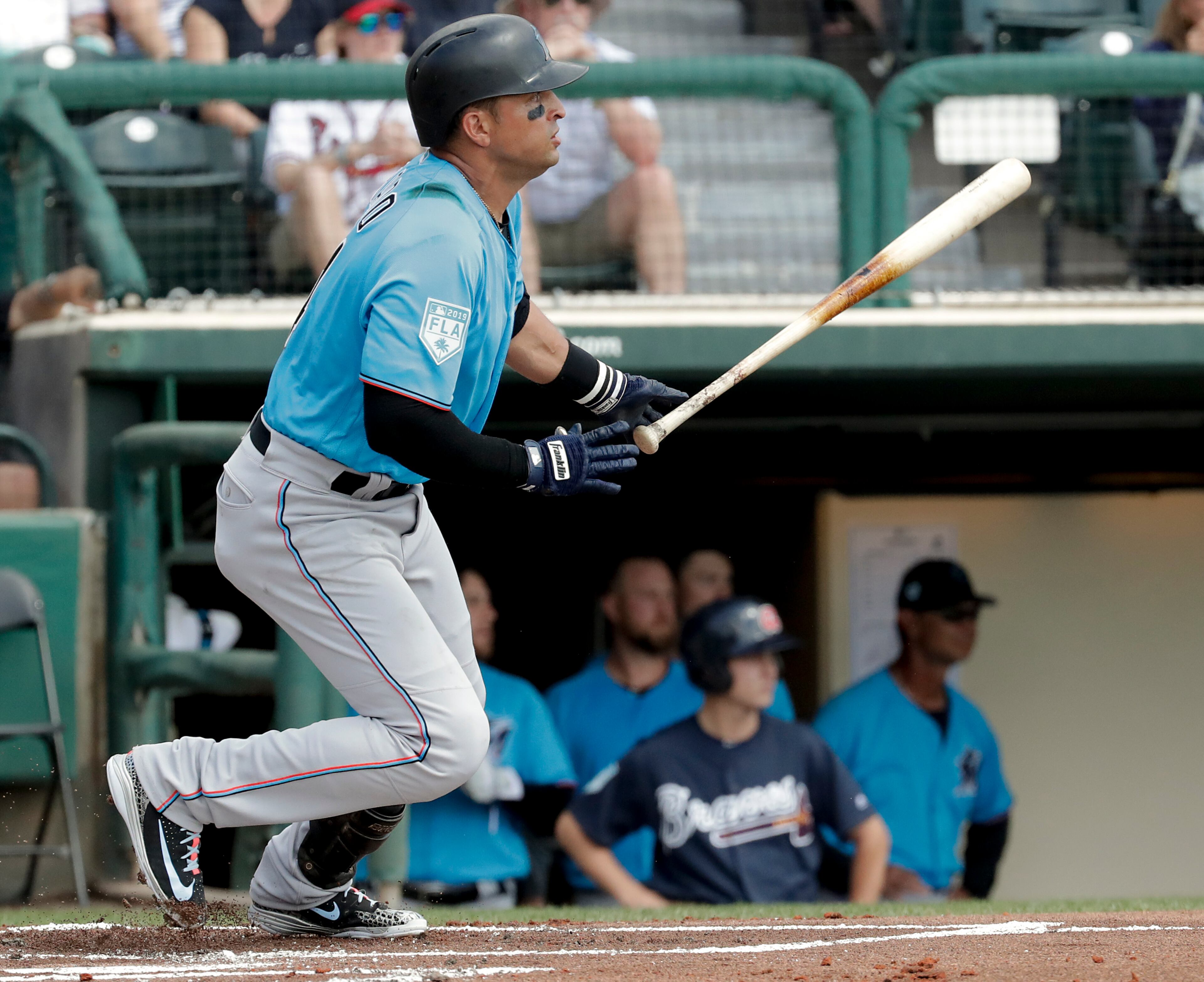 Miami Marlins' Martin Prado hits a double against the Atlanta Braves in the first inning of a spring baseball exhibition game, Friday, March 15, 2019, in Kissimmee, Fla. (AP Photo/John Raoux)