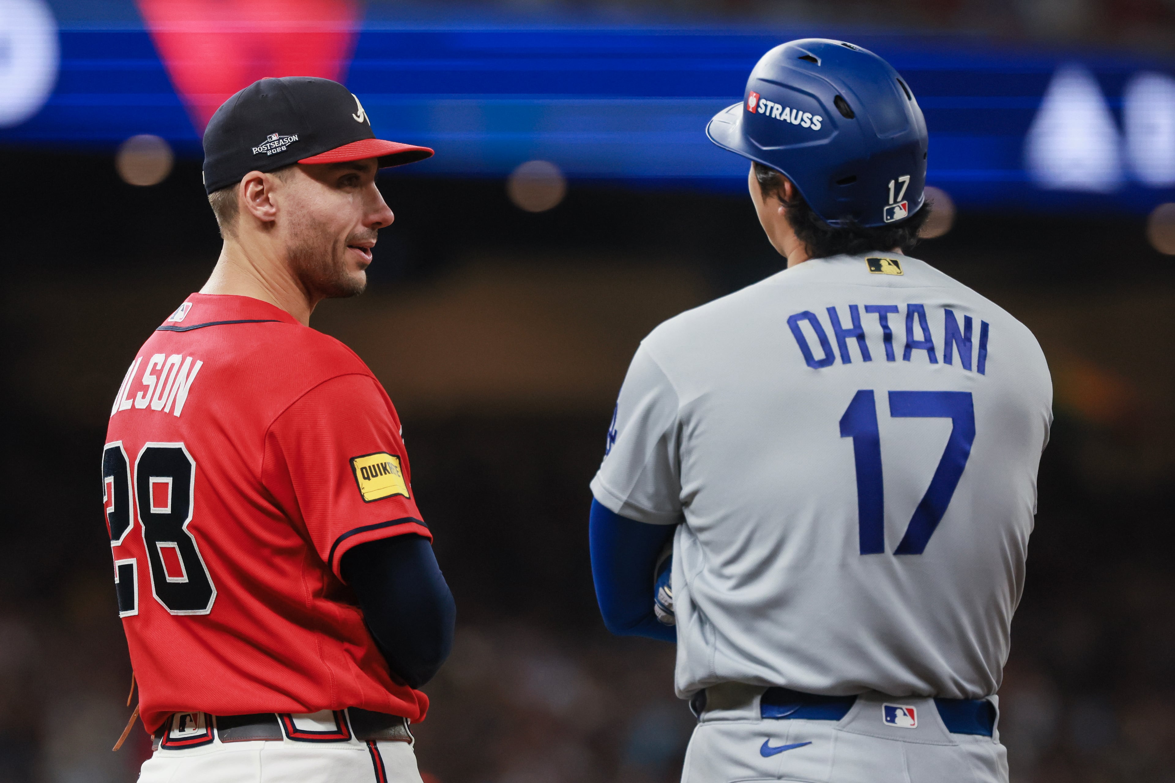 Atlanta Braves first baseman Matt Olson (28) speaks with Los Angeles Dodgers designated hitter Shohei Ohtani (17) during the eighth inning of Game 3 of the MLB National League Division Series between the Atlanta Braves and the Los Angeles Dodgers, Tuesday, Oct. 6, 2026, in Atlanta. (Jason Getz/AJC)