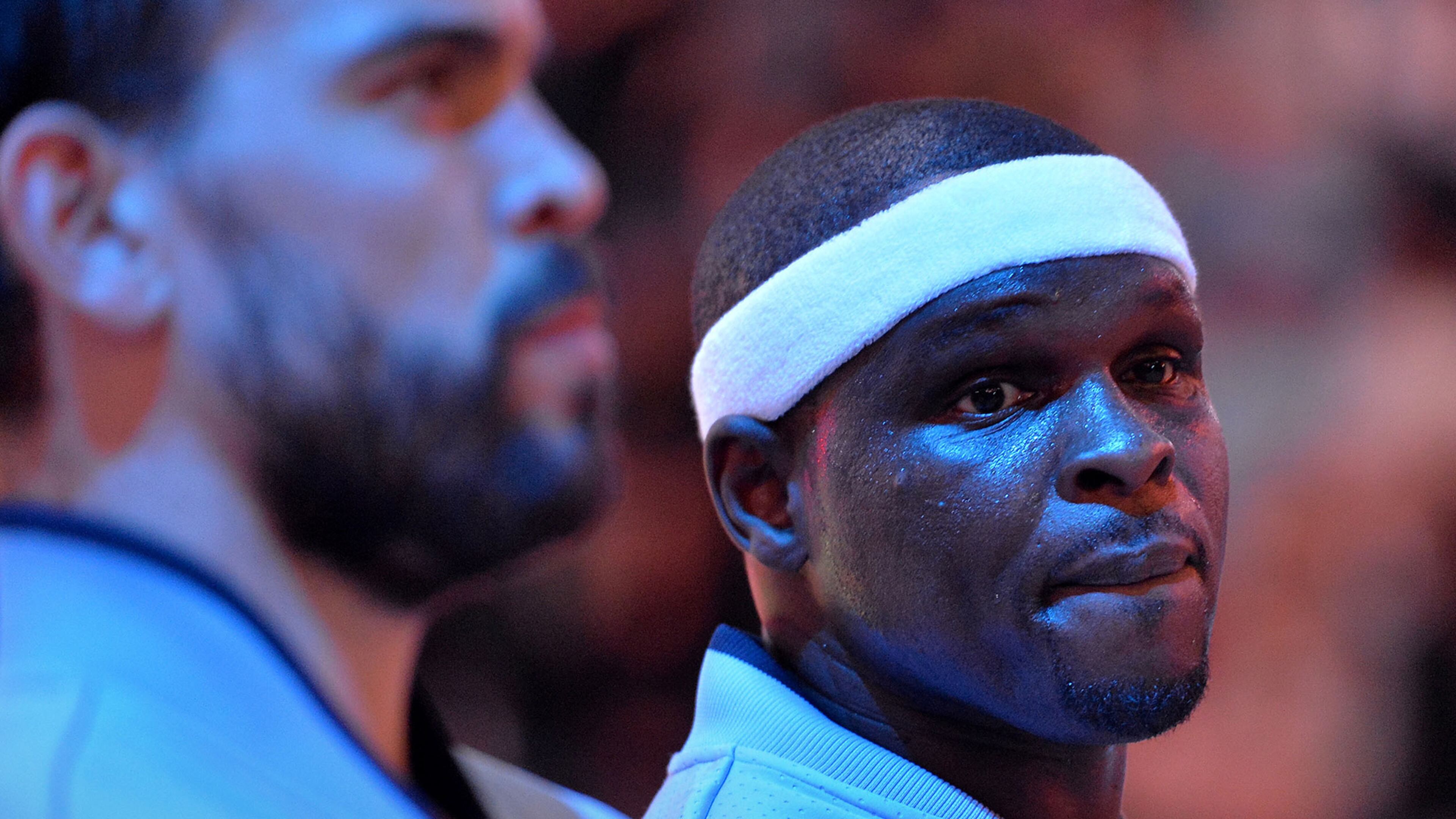 Memphis Grizzlies center Marc Gasol, left, and forward Zach Randolph stand on the court during the singing of the National Anthem before an NBA basketball game against the Portland Trail Blazers Friday, Nov. 13, 2015, in Memphis, Tenn. (AP Photo/Brandon Dill)