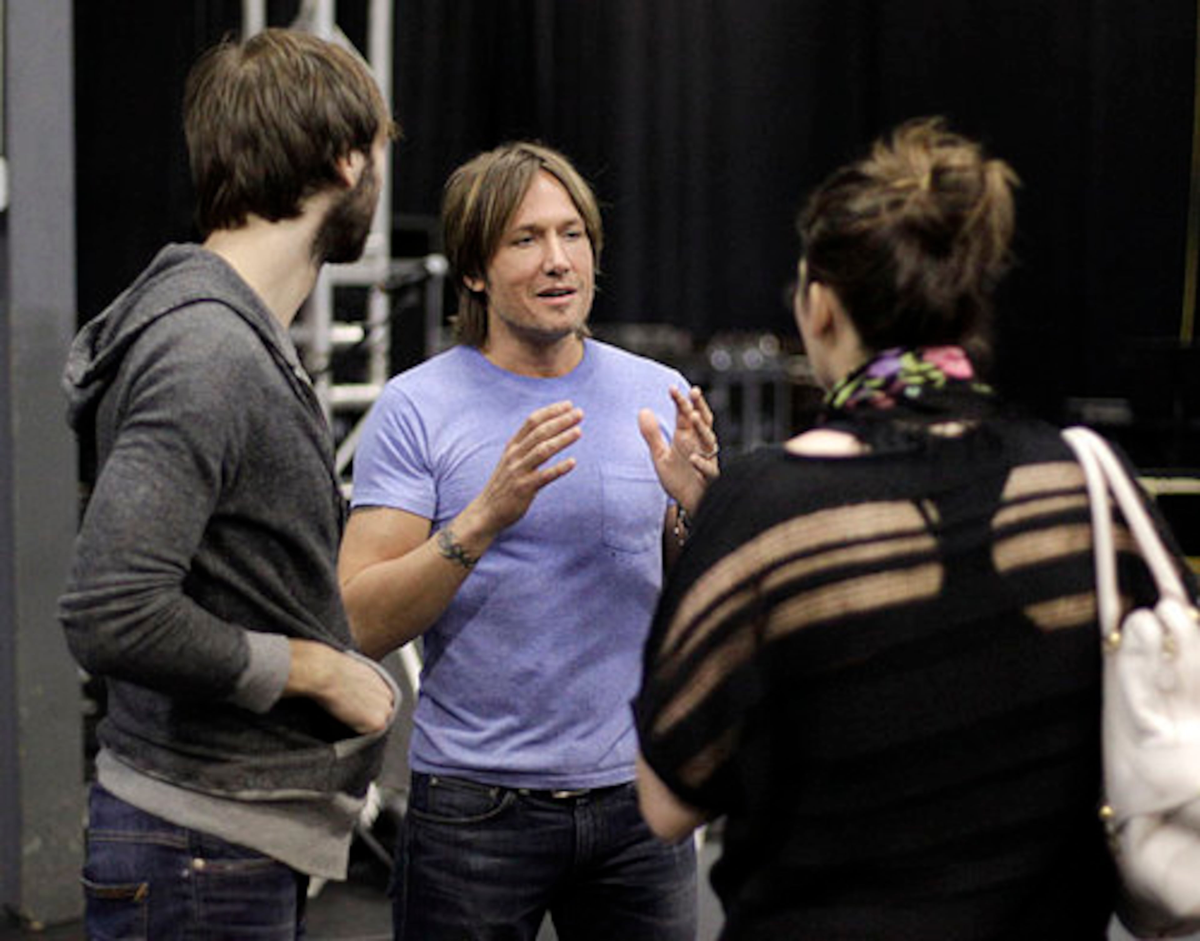 Keith Urban, center, talks with Dave Haywood, left, and Hillary Scott, right, of Lady Antebellum. All for the Hall, headlined by Urban and Vince Gill, is a benefit for the Country Music Hall of Fame and Museum and is scheduled to be held Tuesday.