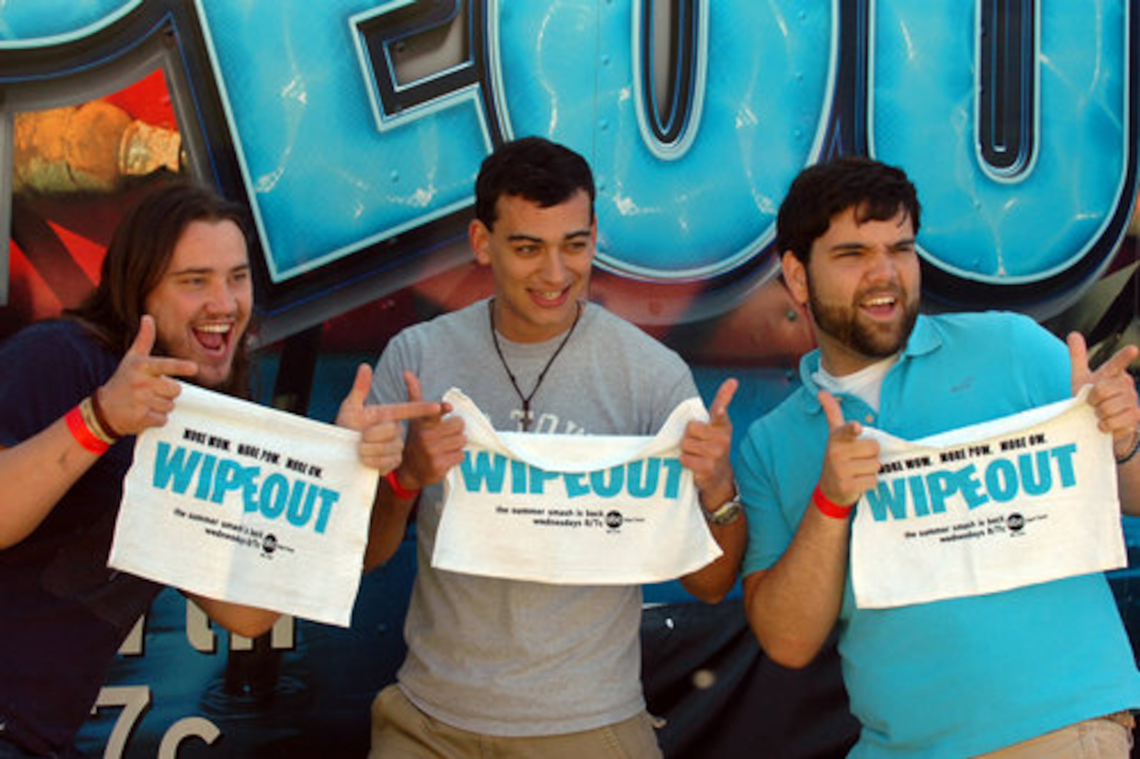 Winthrop University students Noah Rawls, J.D. Park and T.J Ellis pose for a souvenir photo after running the obstacle course.
