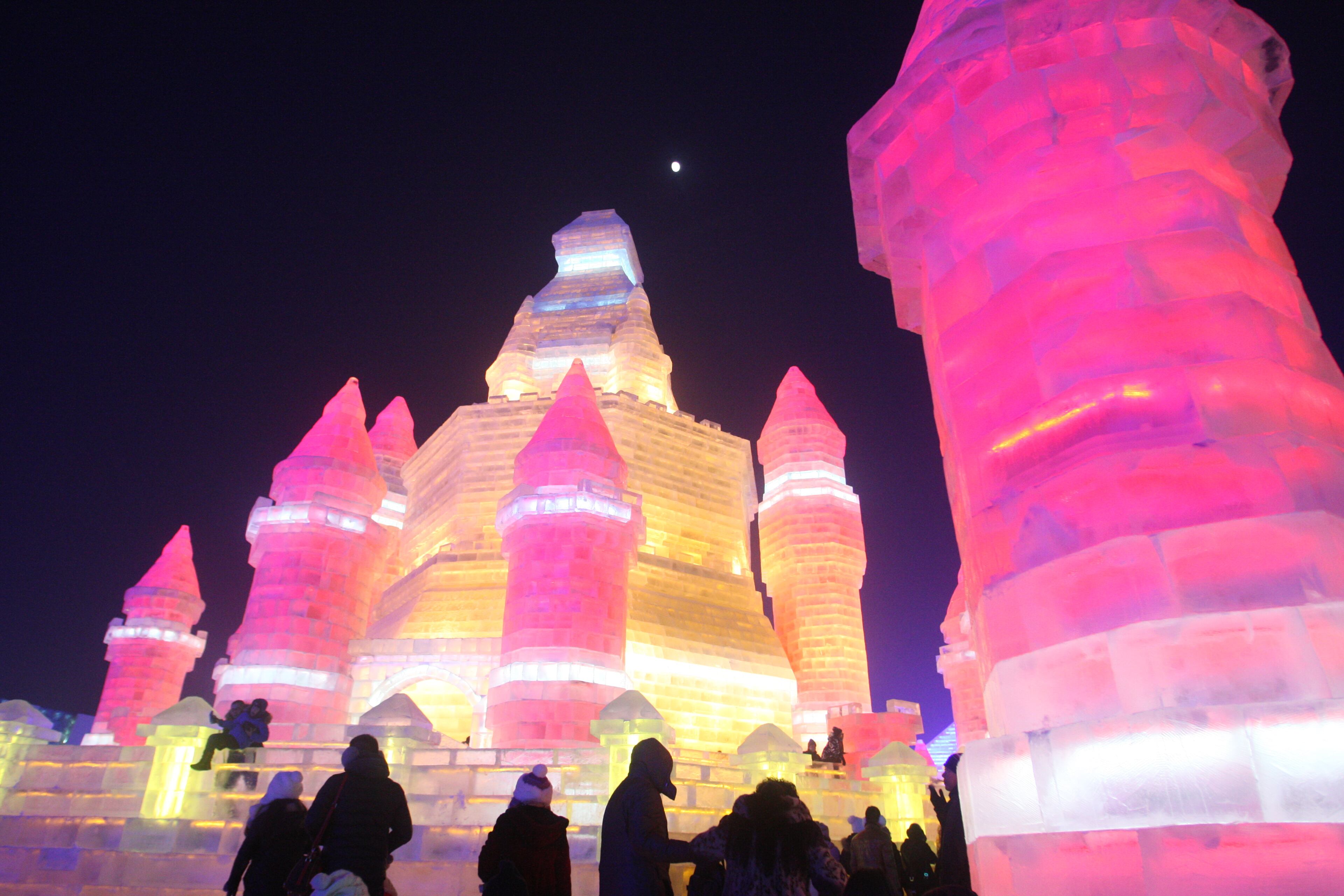 HARBIN, CHINA - DECEMBER 22: (CHINA OUT) Tourists visit the 17th Harbin Ice And Snow World during its test run on December 22, 2015 in Harbin, China. The event will run from December 25, 2015 to February 25, 2016. (Photo by ChinaFotoPress/ChinaFotoPress via Getty Images)