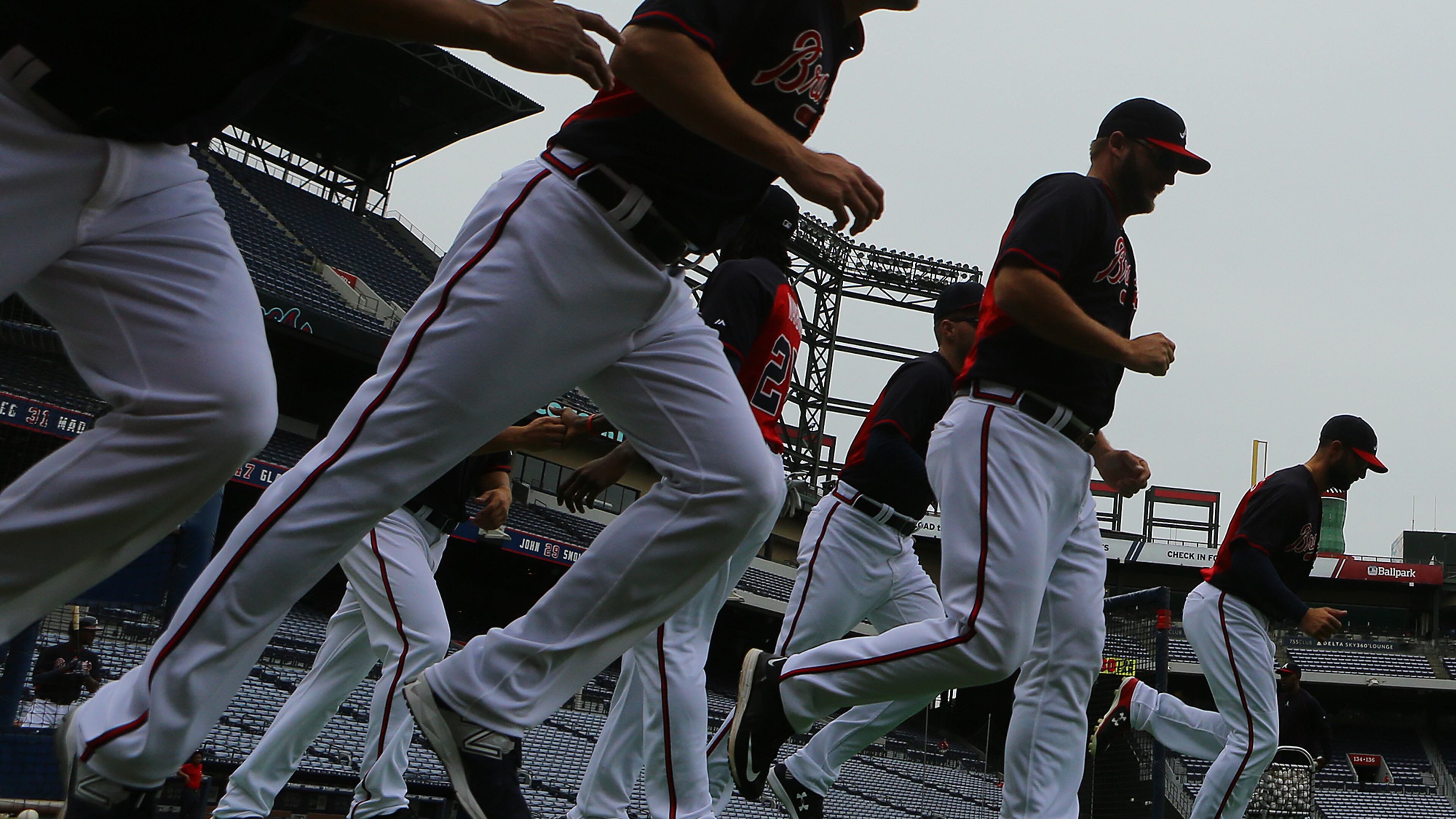 The Braves take the field to loosen up for batting practice before playing the Nationals in a baseball game on Monday, April 27, 2015, in Atlanta. Curtis Compton / ccompton@ajc.com