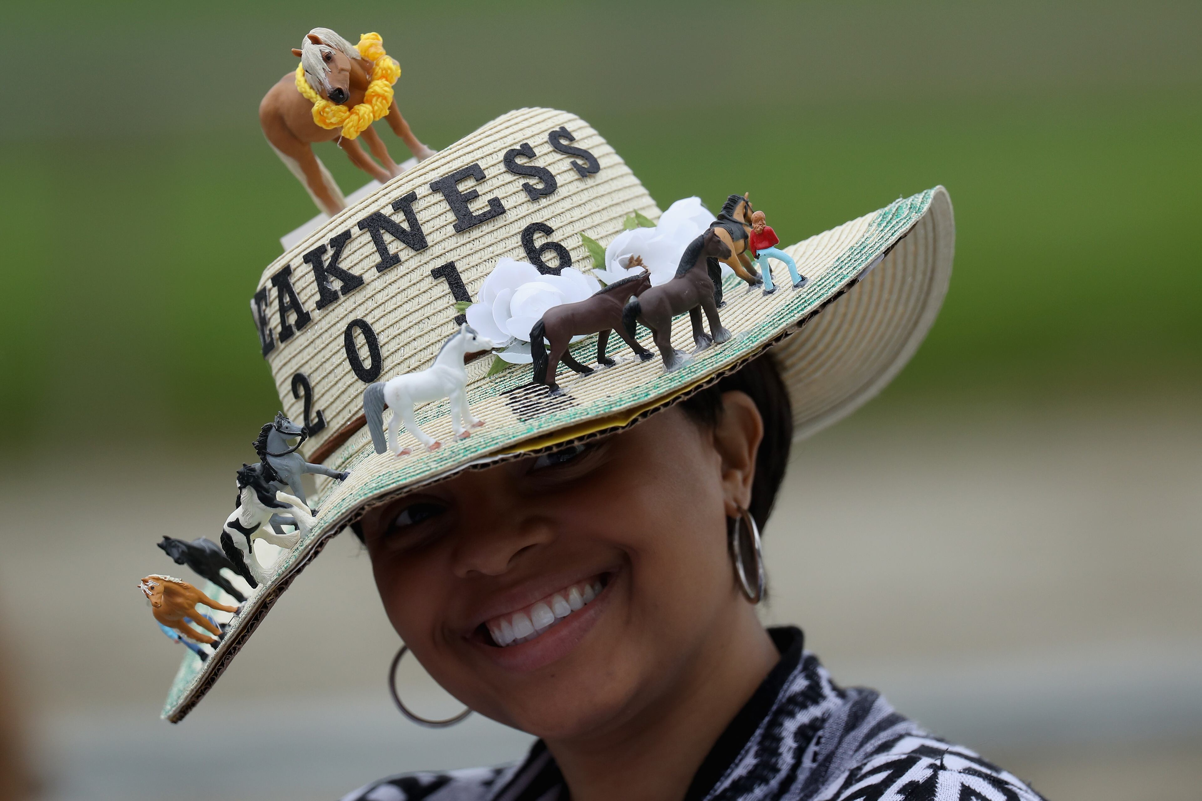 BALTIMORE, MD - MAY 21: A woman wears a Preakness hat during the 141st running of the Preakness Stakes at Pimlico Race Course on May 21, 2016 in Baltimore, Maryland. (Photo by Rob Carr/Getty Images)