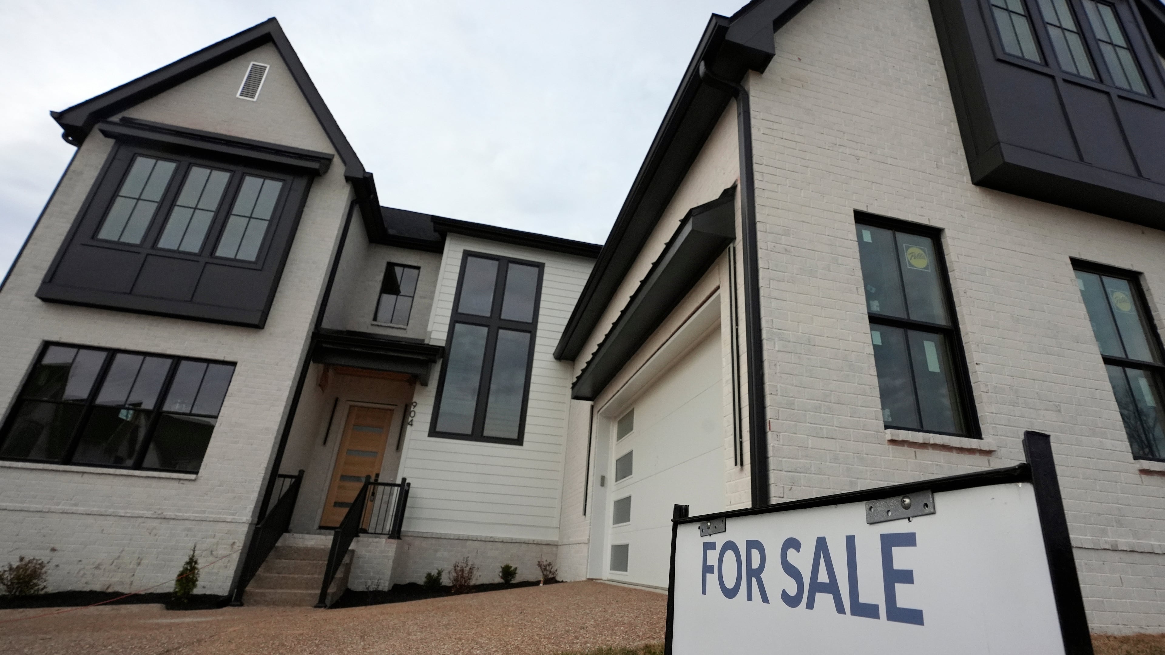 FILE - A for sale sign is posted outside a home, Feb. 10, 2026, in Nashville, Tenn. (AP Photo/George Walker IV, file)