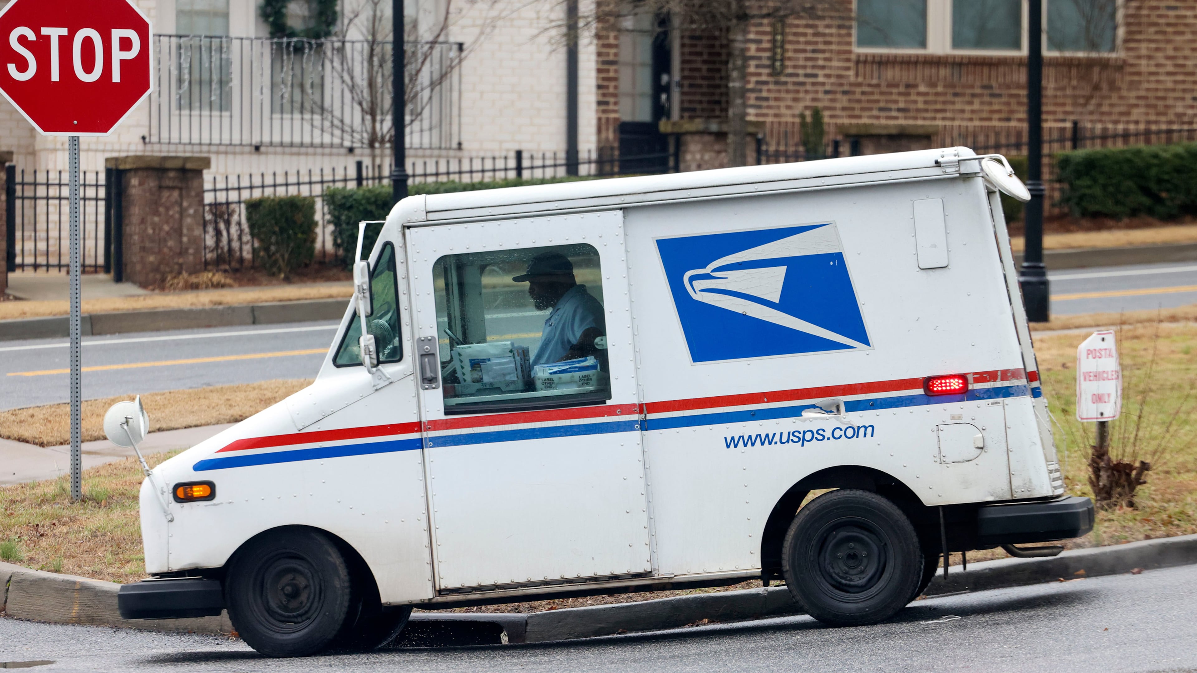 A surge of last-minute absentee ballots requested Oct. 25 will be shipped via U.S. Postal Service Express Mail or UPS Overnight to be delivered by Friday — the last day of early voting. (Jason Getz/The Atlanta Journal-Constitution/TNS)