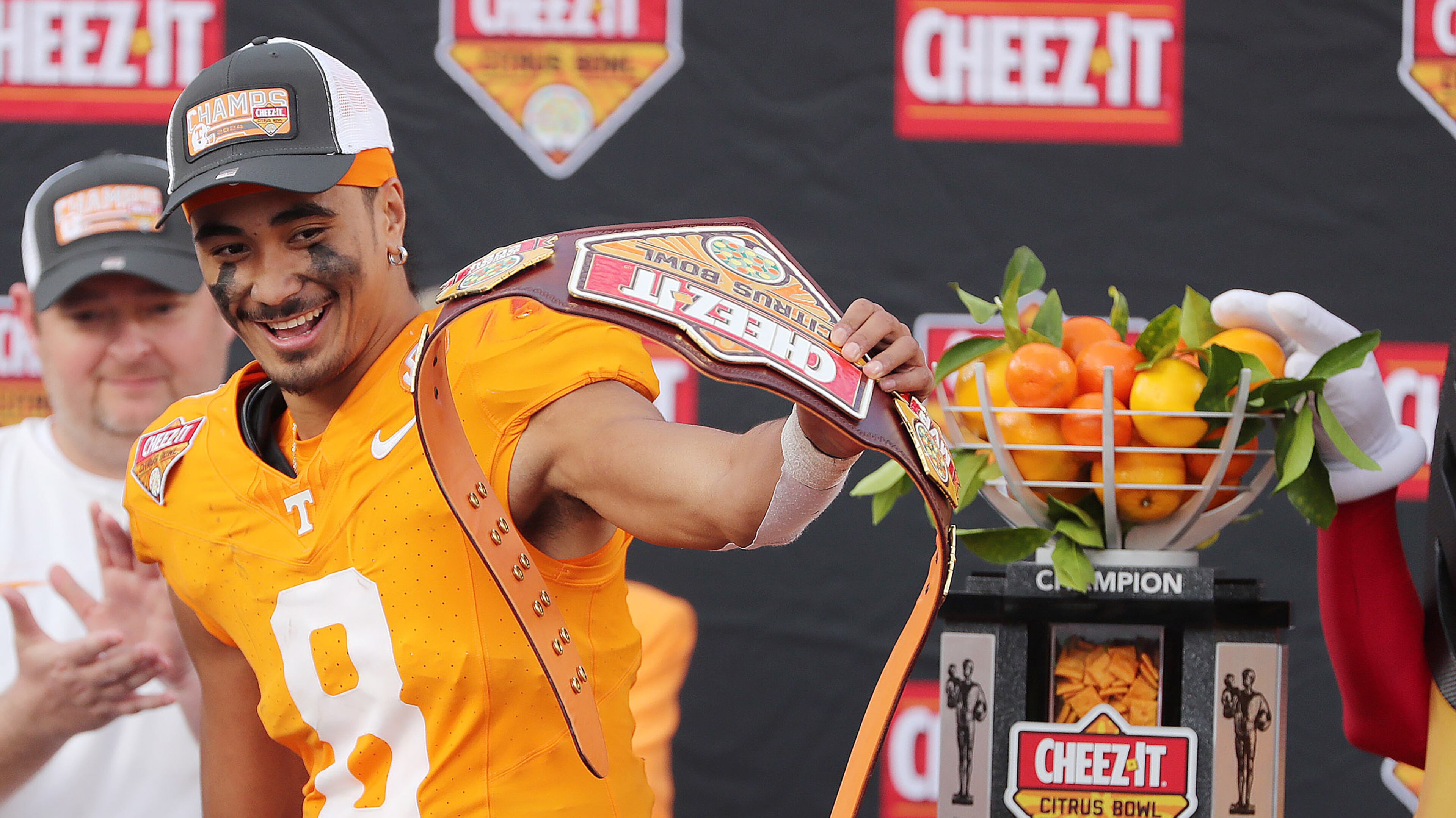 Tennessee quarterback Nico Iamaleava celebrates with the championship trophy after winning the Cheez-It Citrus Bowl college football game of Tennessee versus Iowa at Camping World Stadium in Orlando on Monday, Jan. 1, 2024. Tennessee won the game 35-0. (Stephen M. Dowell/Orlando Sentinel/TNS)