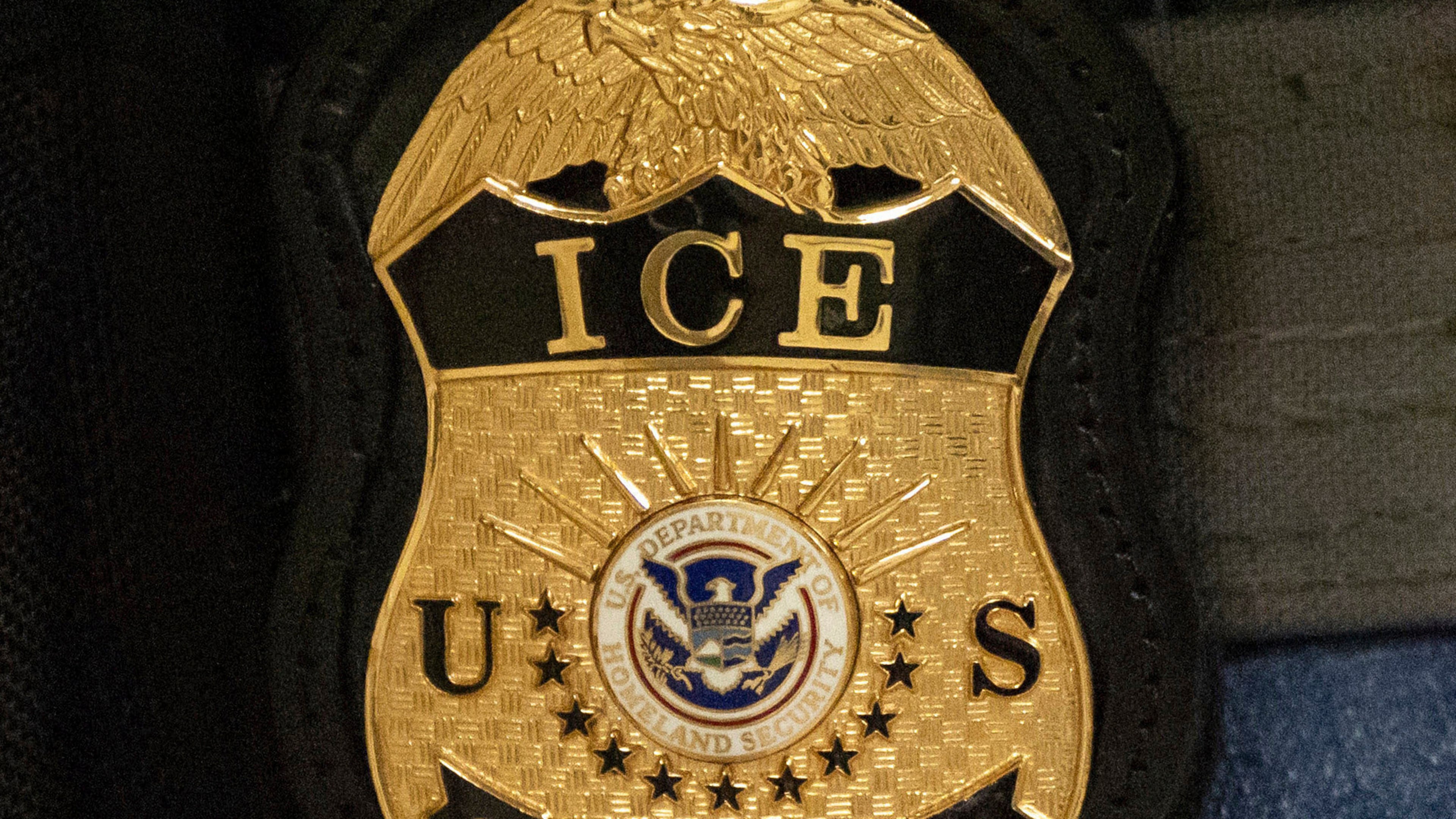 FILE - A federal agent wears an Immigration and Customs Enforcement badge in New York, June 10, 2025. (AP Photo/Yuki Iwamura, File)