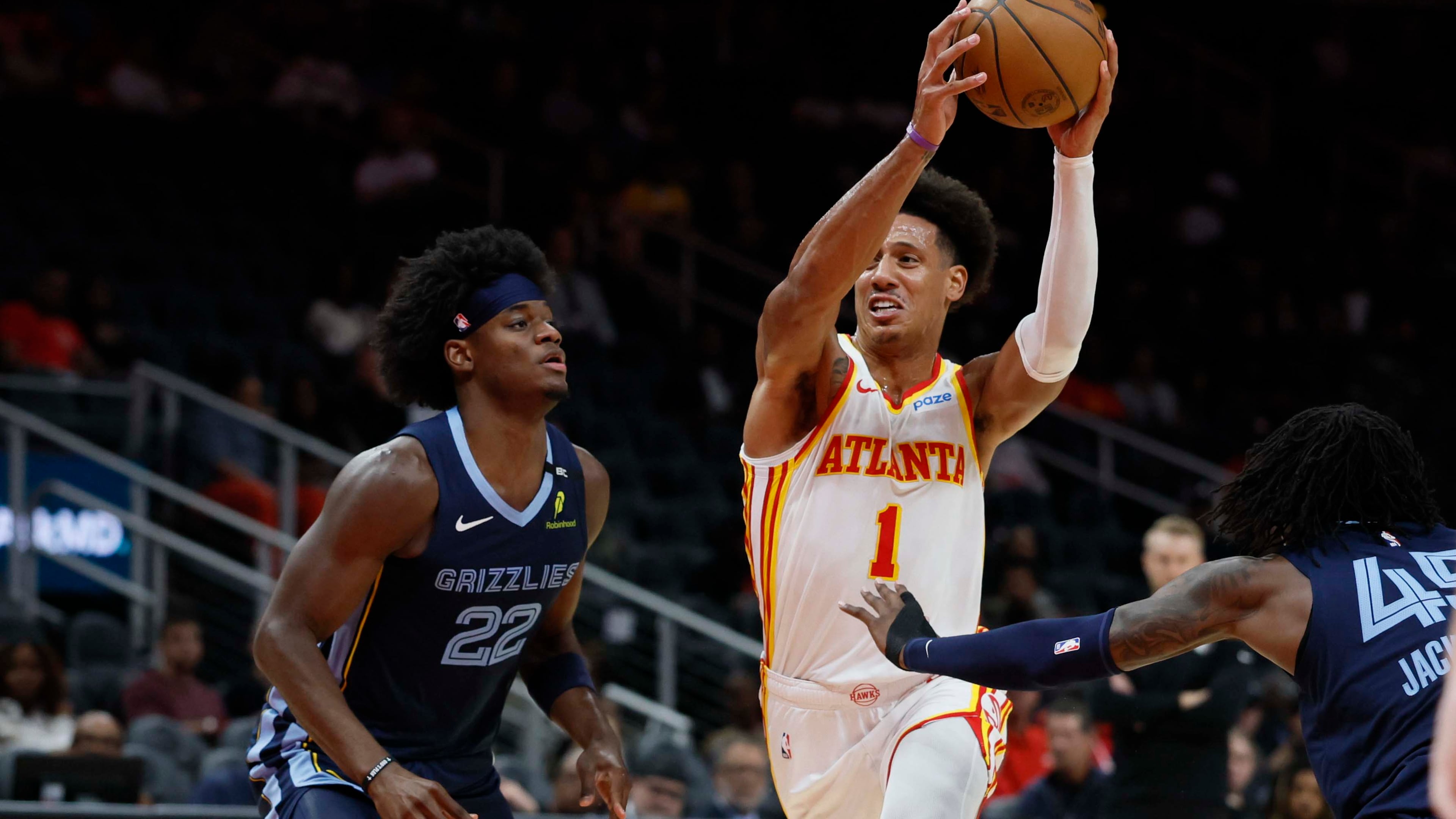 Atlanta Hawks forward Jalen Johnson battles Memphis Grizzlies forward Taylor Hendricks in the first half of a preseason NBA game at State Farm Arena in Atlanta, GA, on Monday, Oct. 5, 2026. (Miguel Martinez/AJC)