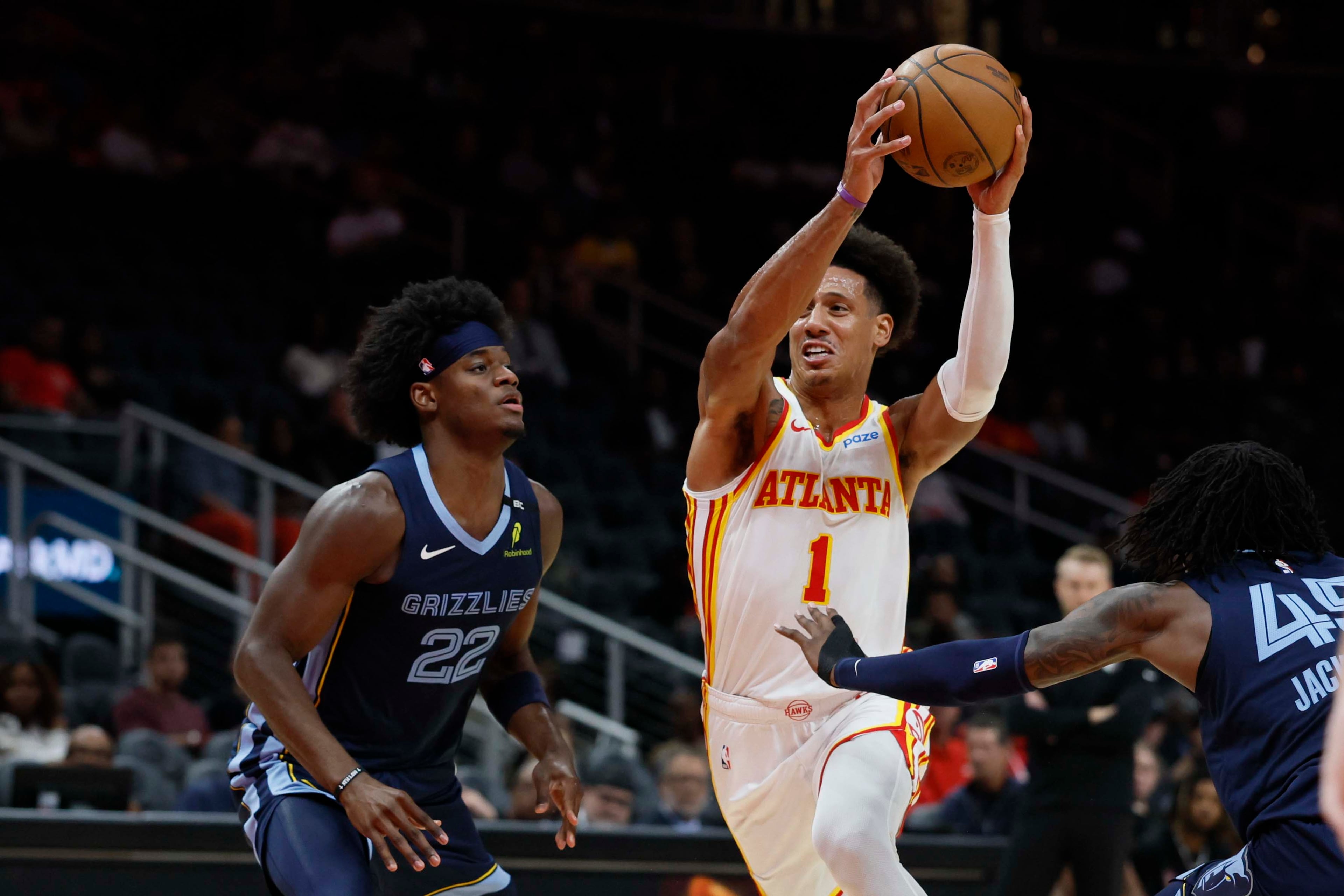 Atlanta Hawks forward Jalen Johnson battles Memphis Grizzlies forward Taylor Hendricks (left) in the first half of a preseason NBA game at State Farm Arena in Atlanta on Monday, Oct. 5, 2026. The Hawks lost their preseason home opener 132-123. (Miguel Martinez/AJC)