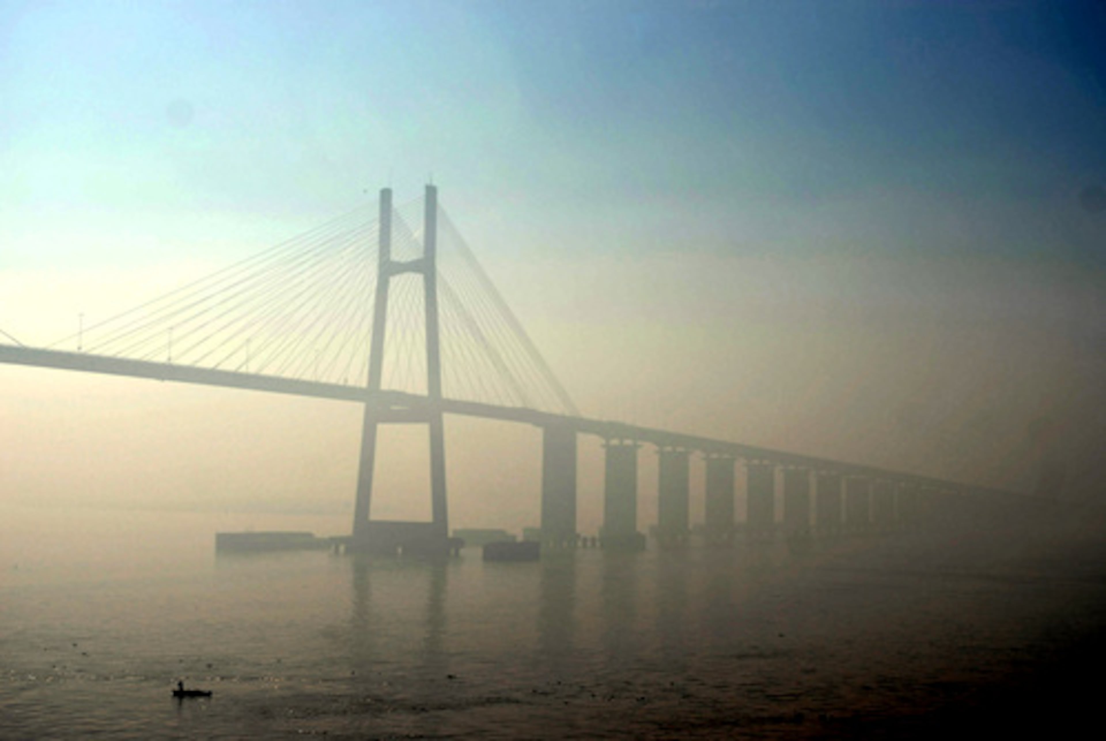 In Rosario, Argentina, the bridge connecting Rosario city with Victoria is covered in smoke on Sunday. The Argentine National Institute of Agrotechnology reported hundreds of fires late last week causing a thick mantle of smoke to reach the Buenos Aires capital.