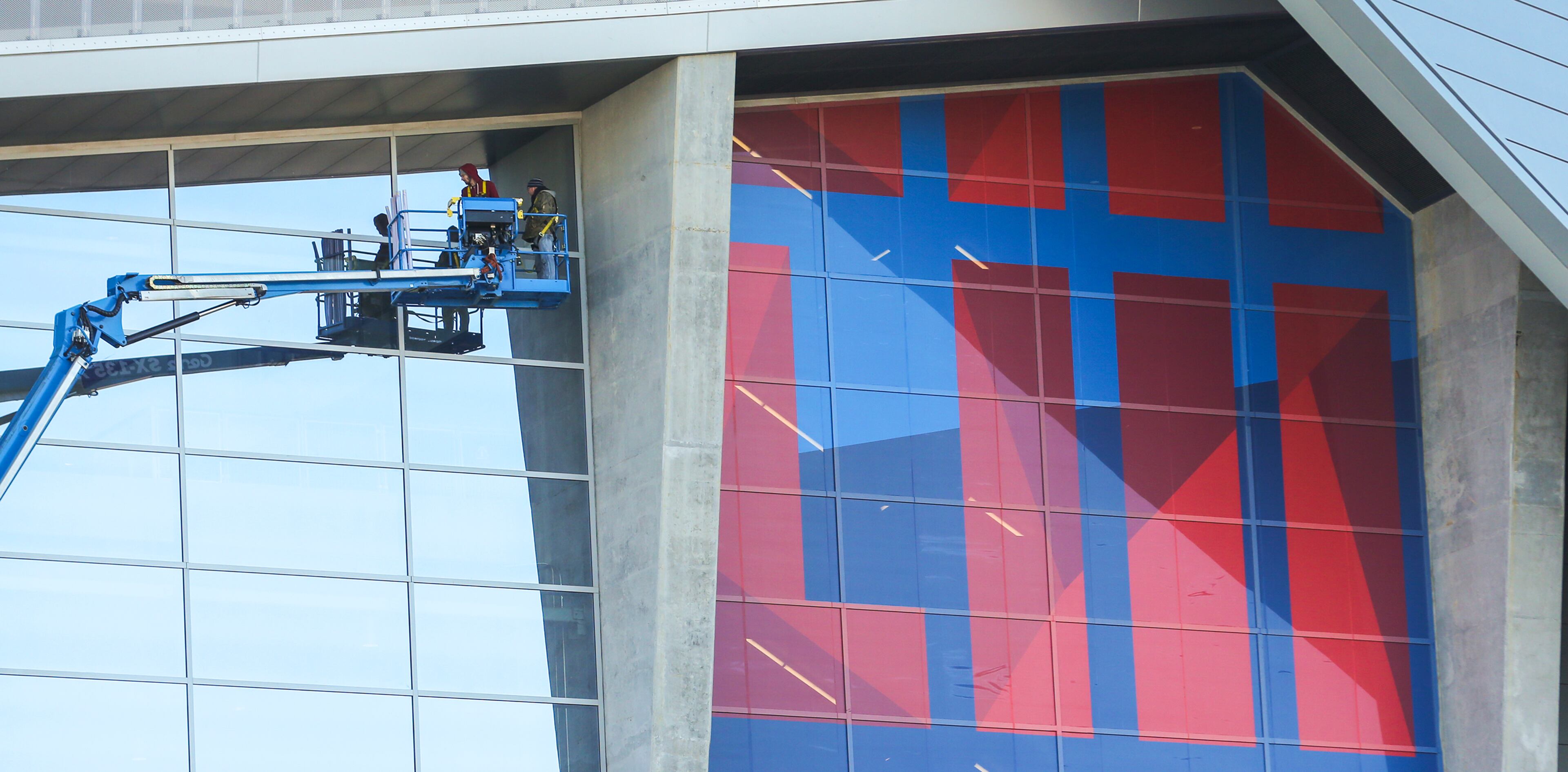 January 16, 2019 Atlanta: Workers adhere giant Super Bowl graphics on Mercedes Benz Stadium Structures as structures and Super Bowl related imagery are popping up everywhere across Atlanta as evident on Wednesday, Jan. 16, 2019 as the city prepares to host Super Bowl 53. Atlanta faces a test on Super Bowl Sunday and the question with less than a month to go before the big game is this: Is the city ready? The city budgeted some $10 million last year for police, fire and other items to assist with the big game. JOHN SPINK/JSPINK@AJC.COM