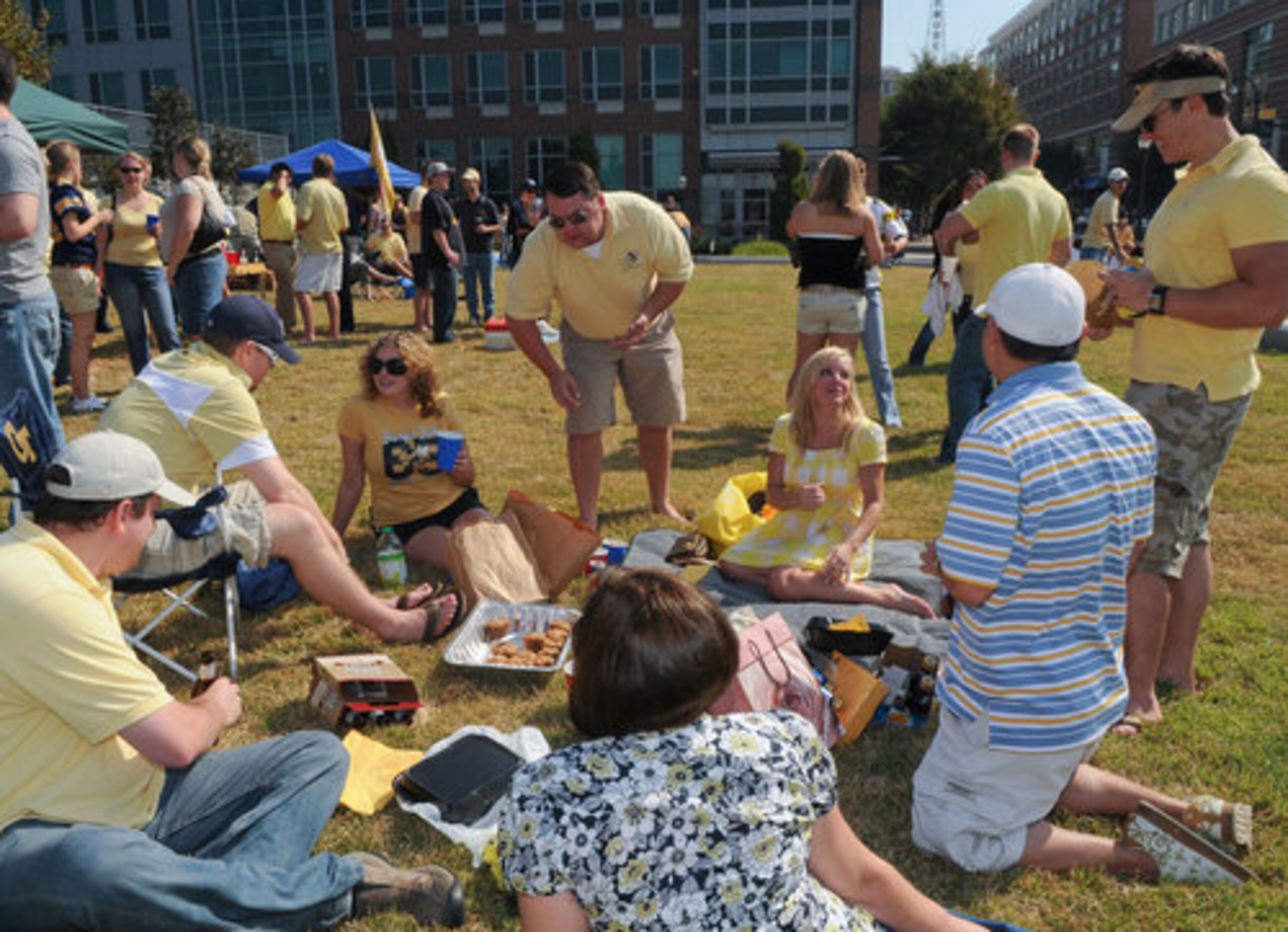 Please pass the muffins: Left to right: Kevin Fitzgerald (in the chair) talks to Maria Jameson, Brian Jones (standing, center), Fern Lloyd, Shane Long, Wayne Zhou, Therese Gesing (back to camera) and Brad Schuyler.