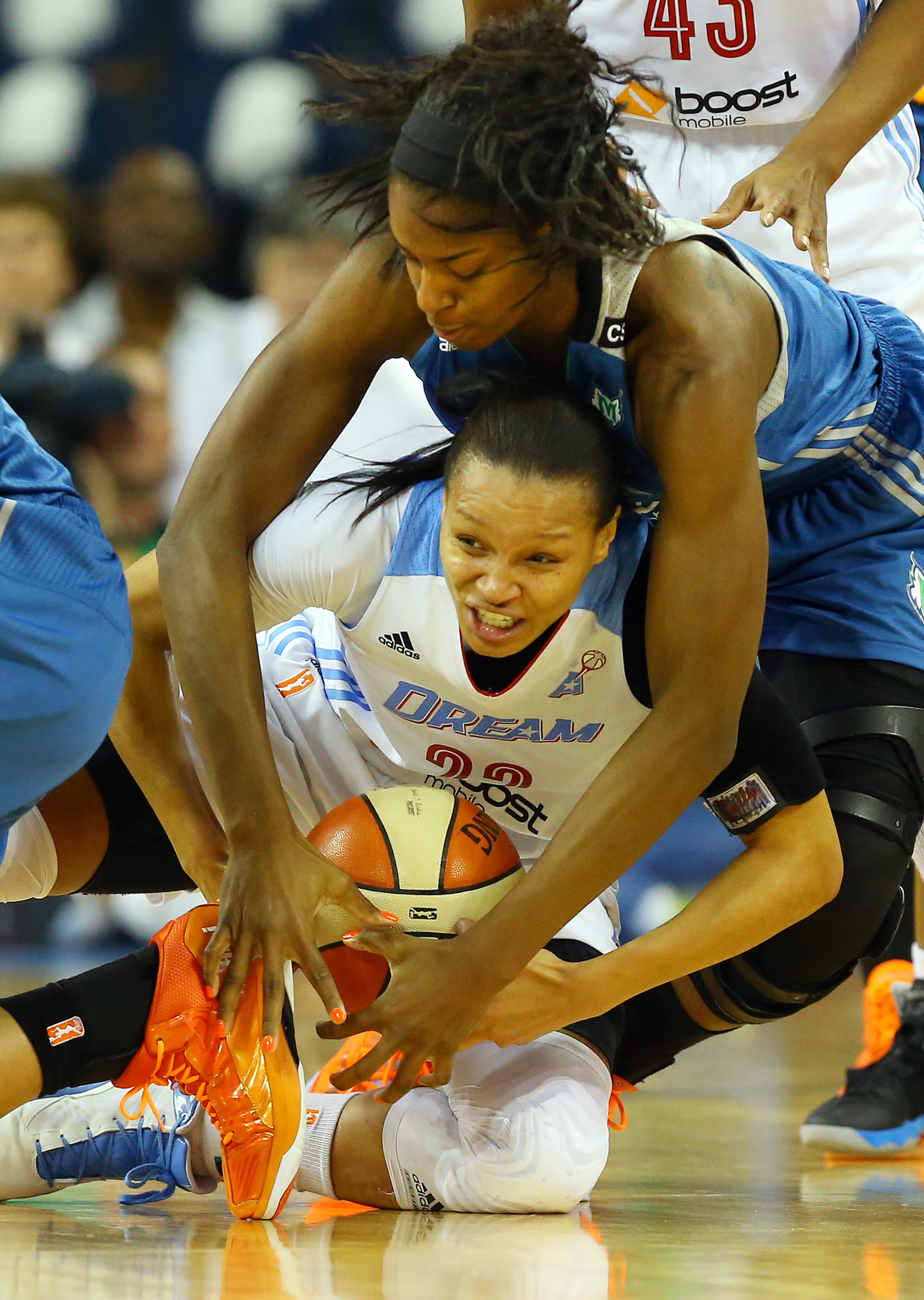 Dream guard Armintie Herrington battles for a lose ball with Lynx forward Devereaux Peters during the first half of their WNBA Finals basketball game 3 on Thursday, Oct. 10, 2013, in Duluth. The Lynx won 86-77.
