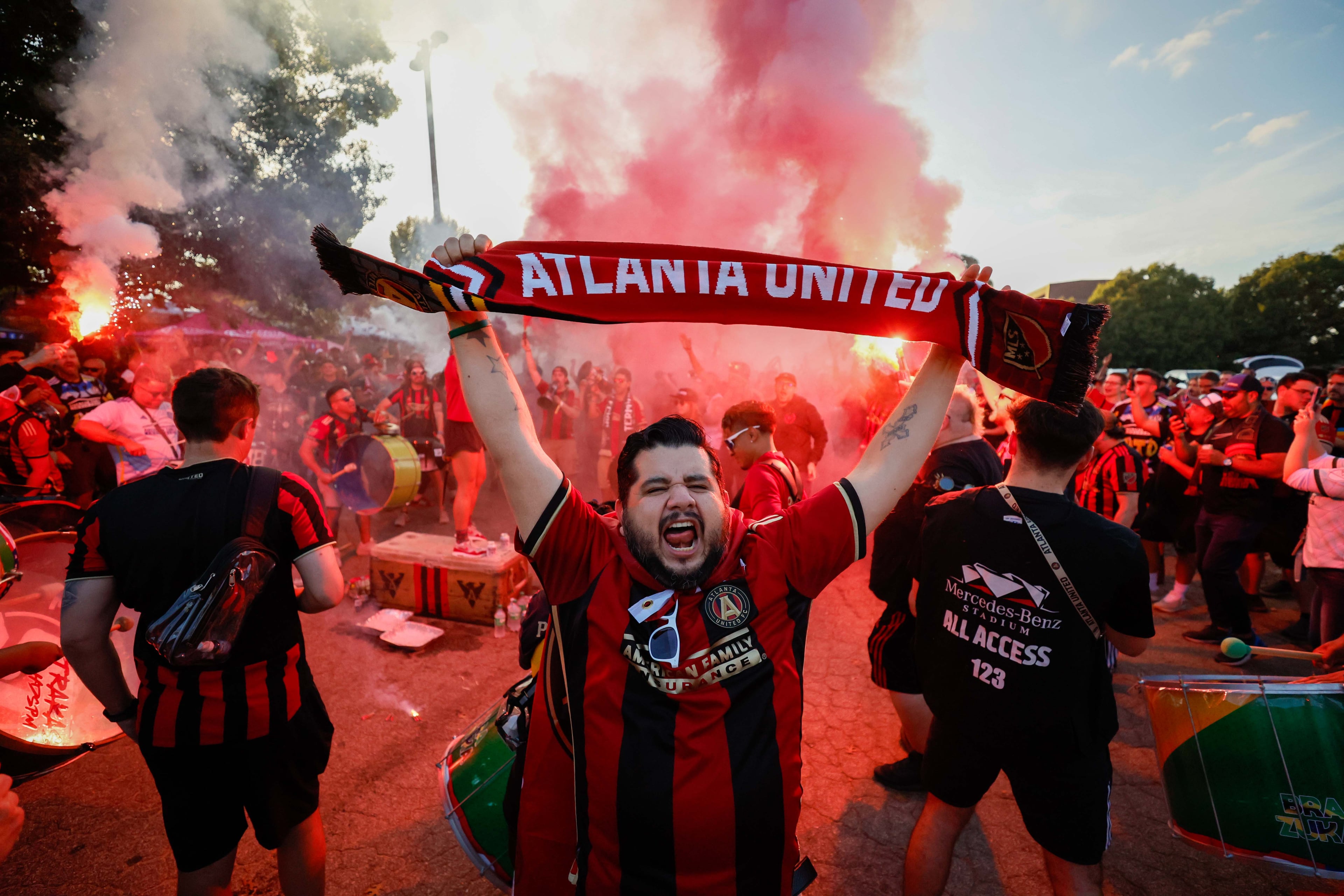 Atlanta United fans cheer as they march to Mercedes-Benz Stadium for the MLS Cup playoff game against Miami on Saturday in Atlanta.
(Miguel Martinez/ AJC)