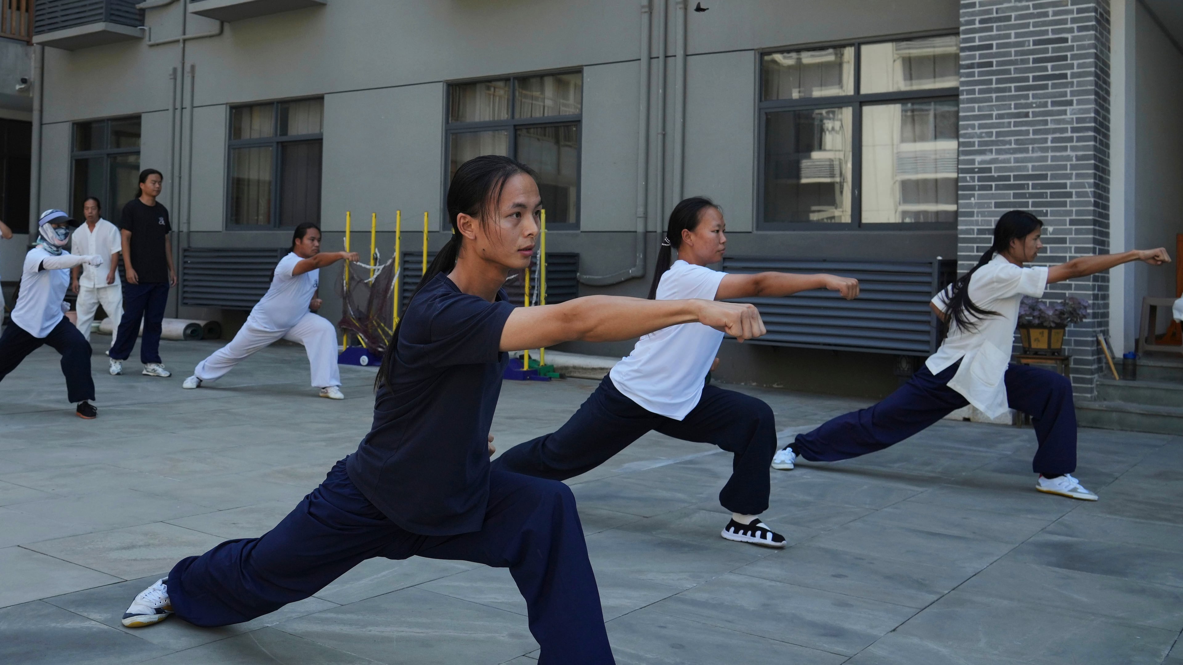 Students practice at the Wudang Taoist Traditional Kung Fu Academy near Wudang Mountain in Shiyan city in central China's Hubei province on Friday, Sept. 4, 2026. (AP Photo/Achmad Ibrahim)