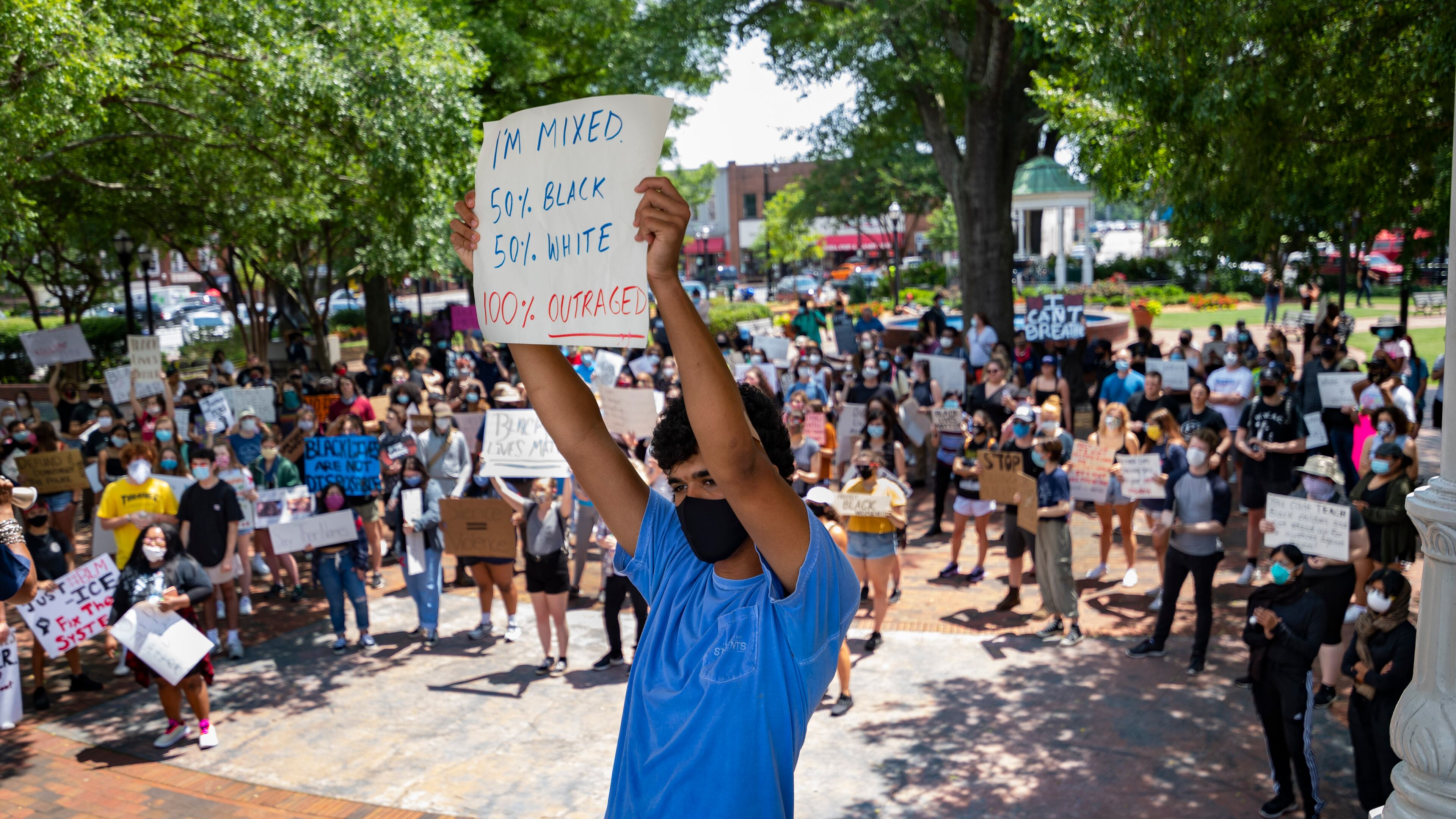 Walton High School student Joseph Fisher, 18, protests in Marietta Square on Wednesday. JOHN AMIS FOR THE ATLANTA JOURNAL-CONSTITUTION