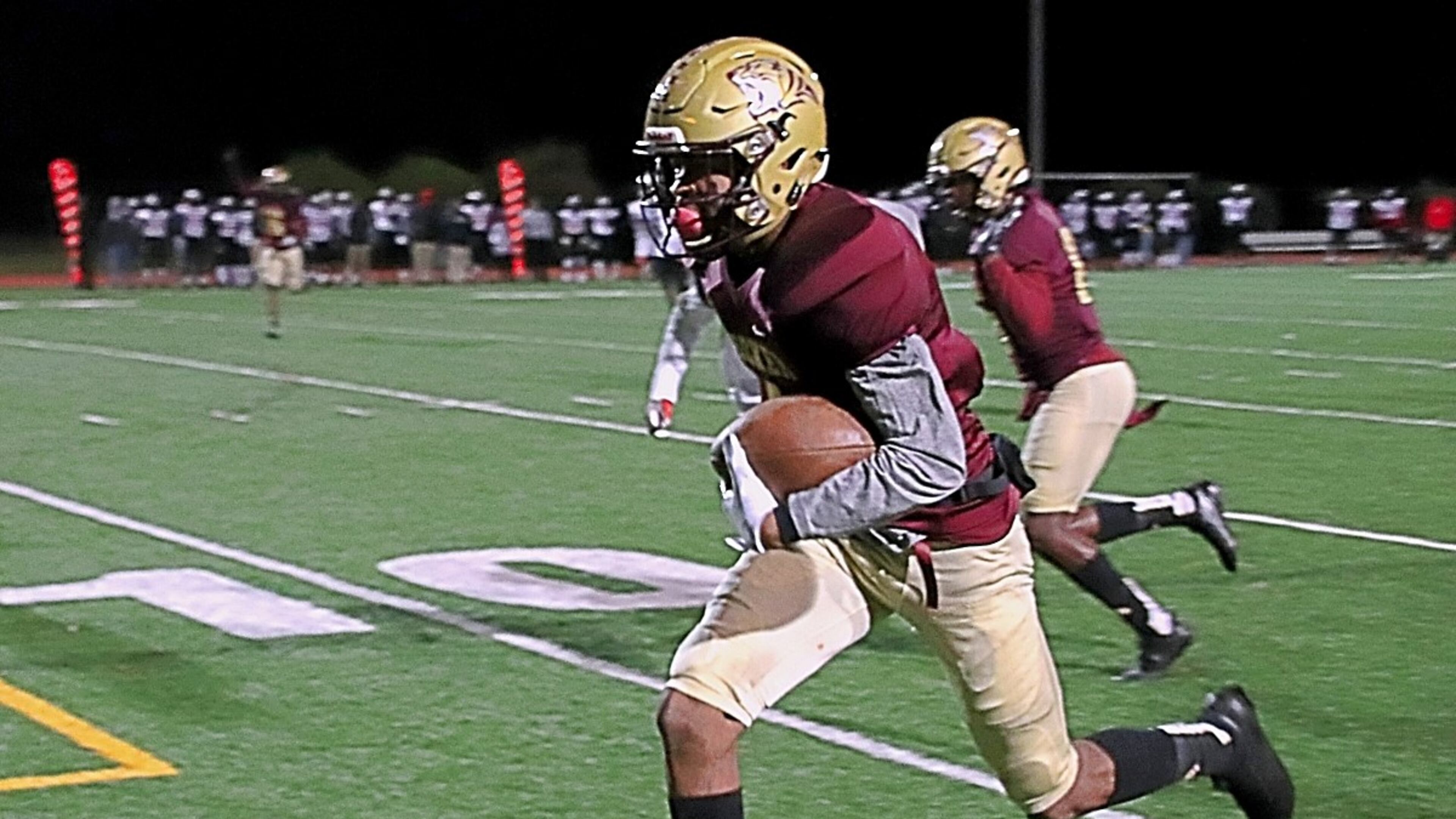 Tucker’s Isaiah Dunson returns an interception 18 yards for a touchdown to open the scoring in Tucker’s 34-6 win over Mt. Zion on Friday. (Photo by Mark Brock)