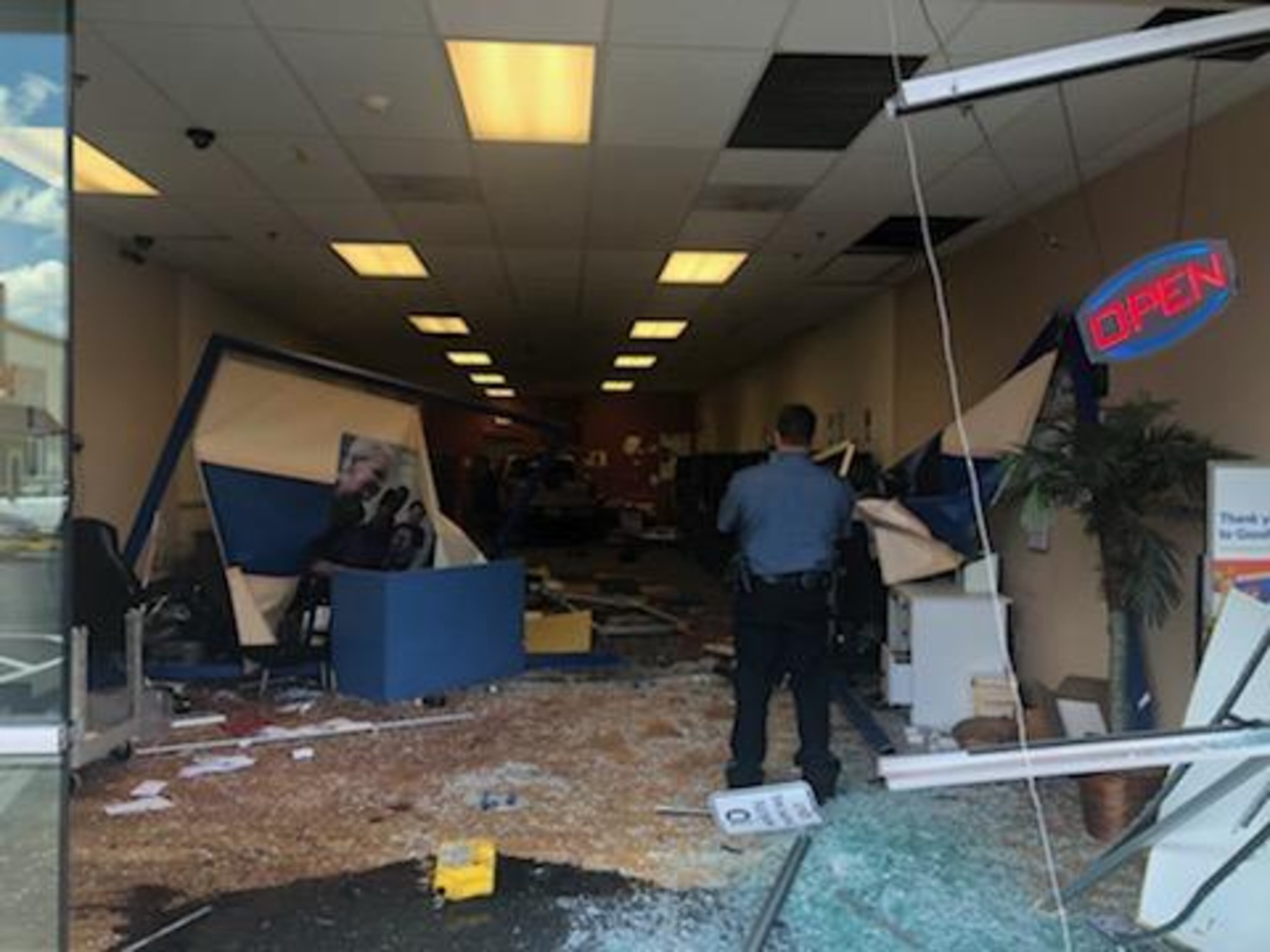 The vehicle came to a complete stop when it hit a concrete wall at the back of the store.