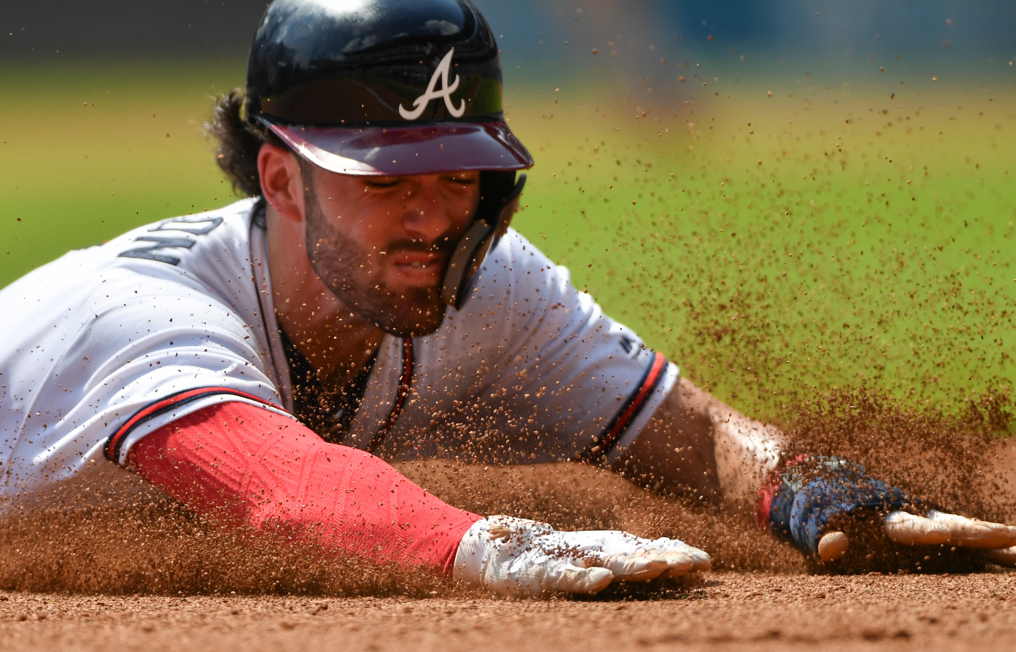 092218 Atlanta: Atlanta Braves Dansby Swanson dives into third, but not before the tag of Philadelphia Phillies third baseman Maikel Franco at SunTrust Park Saturday September 22, 2018. Photo by Brant Sanderlin/AJC