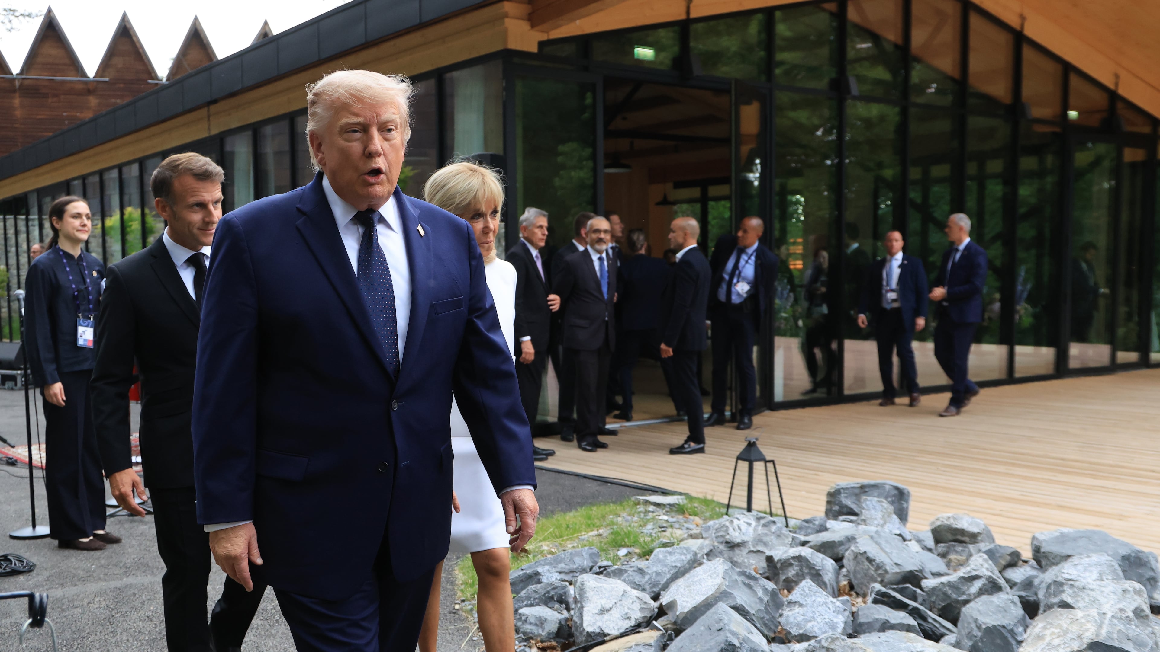 U.S. President Donald Trump walks after posing for a family photo photograph during a gala dinner as part of the G7 summit, in Evian-les-Bains, France, Tuesday June 16, 2026. (Ludovic Marin/Pool Photo via AP)