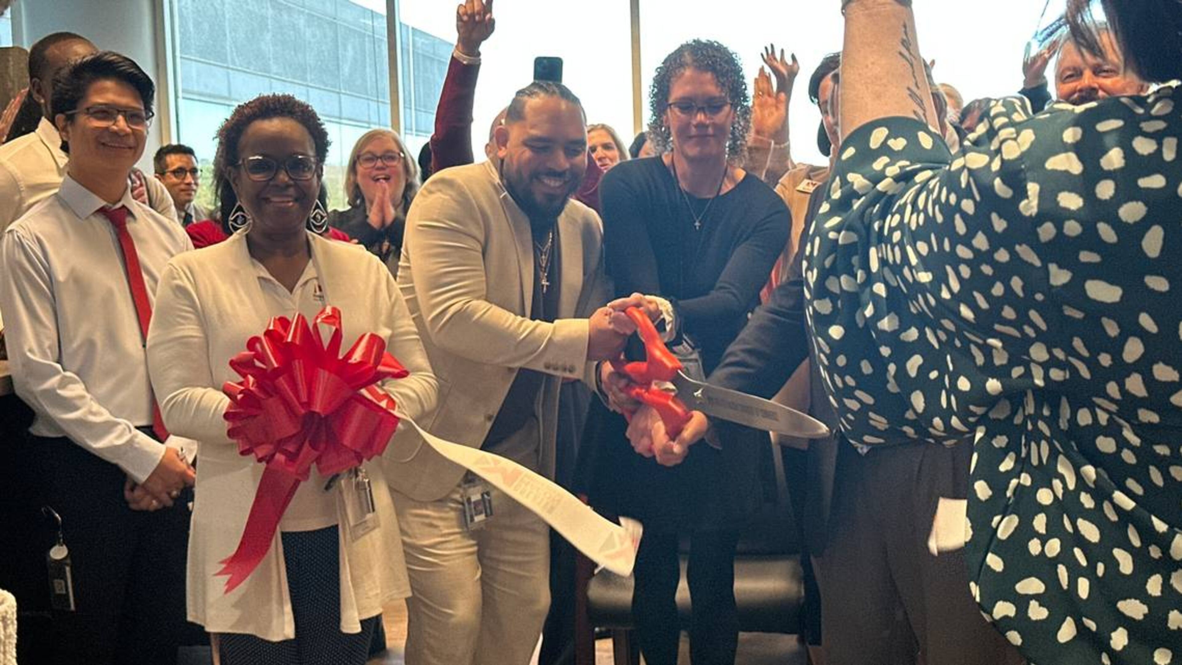 Holly Ireland, interim director of the HOPE Center, joins health care professionals and community members in unveiling the clinic’s new location on Thursday, Jan. 9, 2025. The new space on Arkwright Road promises to bring new services and more privacy to patients. (Photo Courtesy of Lucinda Warnke/The Telegraph)