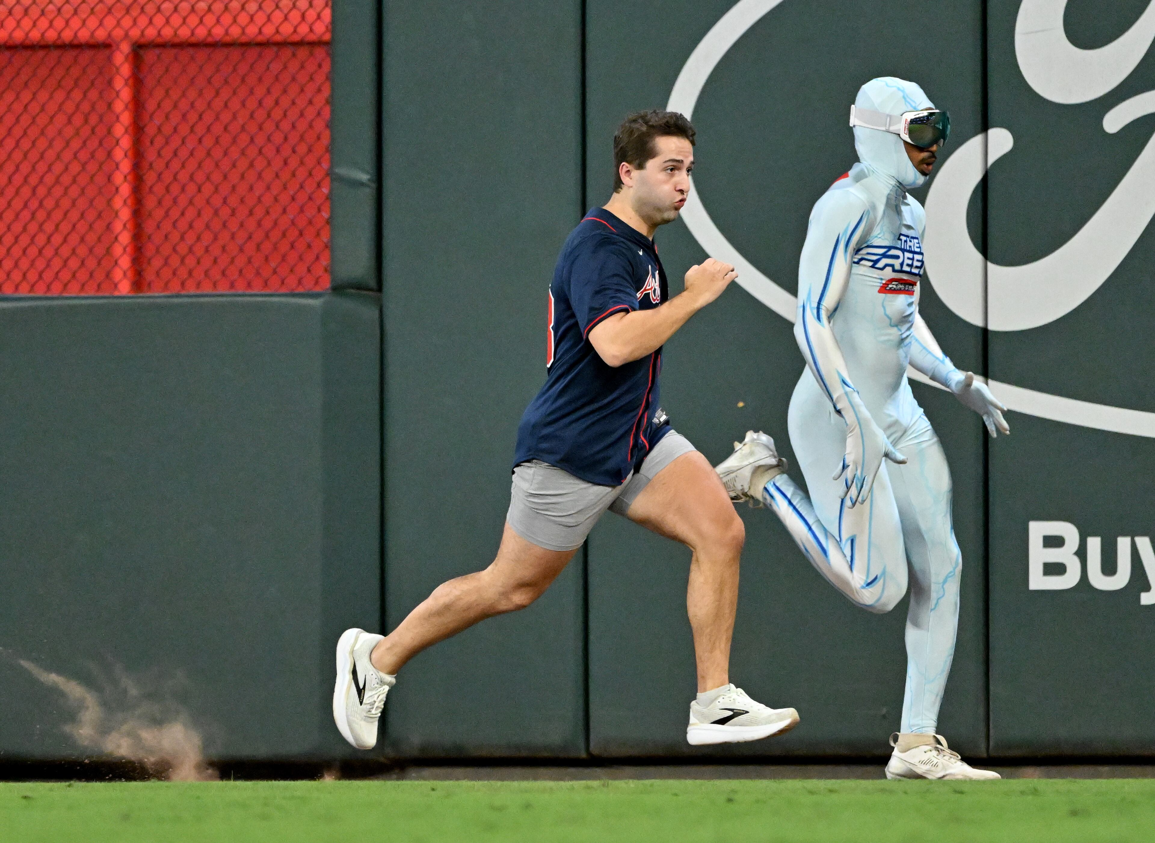 The Atlanta Braves racer "The Freeze" passes a competitor between innings during a baseball game at Truist Park, Tuesday, September 9, 2025, in Atlanta. Chicago Cubs won 6-1 over Atlanta Braves. (Hyosub Shin / AJC)
