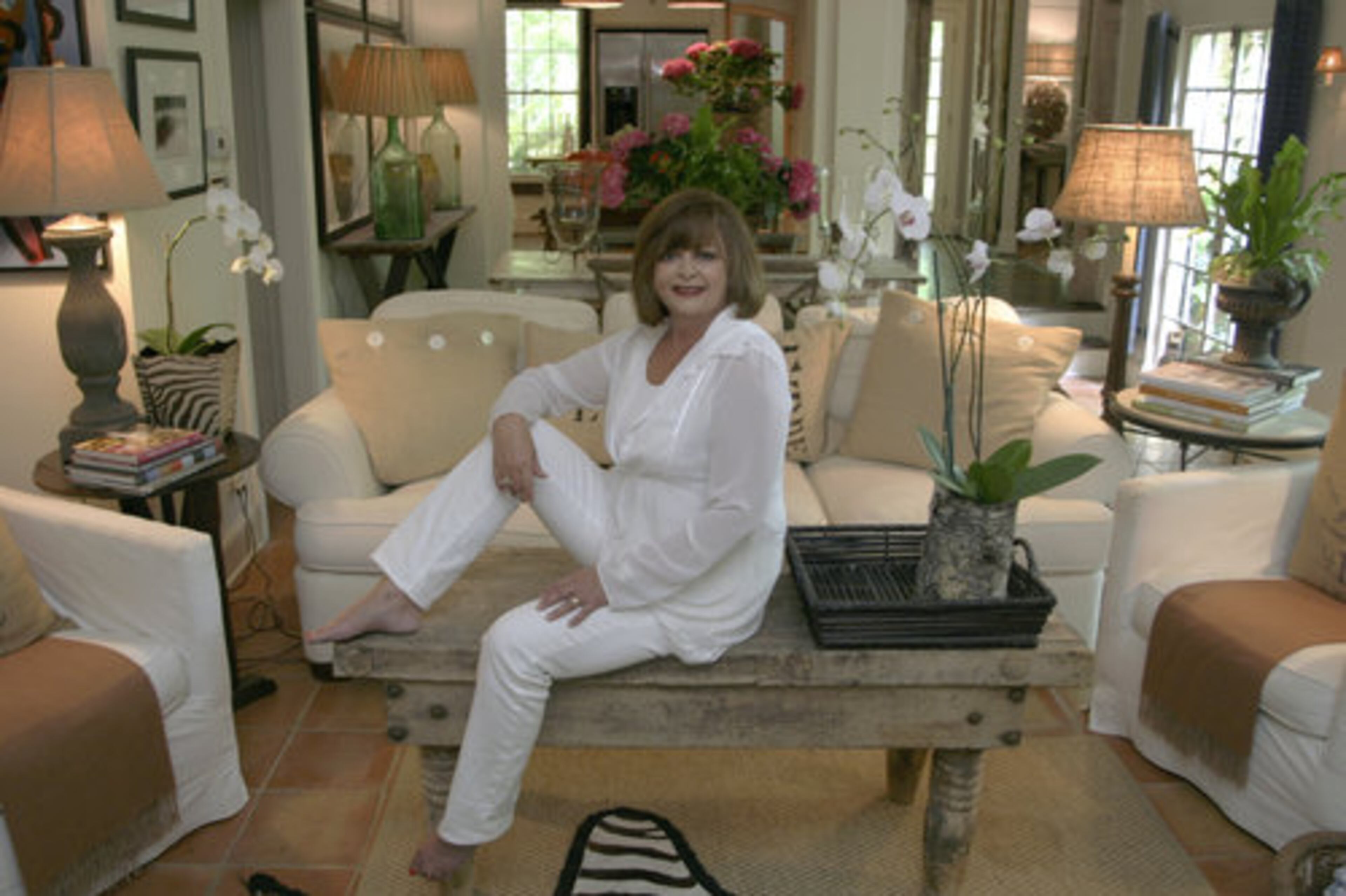 Mary, an interior designer, says her design style sets a neutral palette and incorporates color only in accent pieces. "I could change the focus of this room by just changing the accessories. I use a lot of black and white photography." Any home she designs will have: "Great lamps, a big comfortable feeling, and always be very sophisticated."
