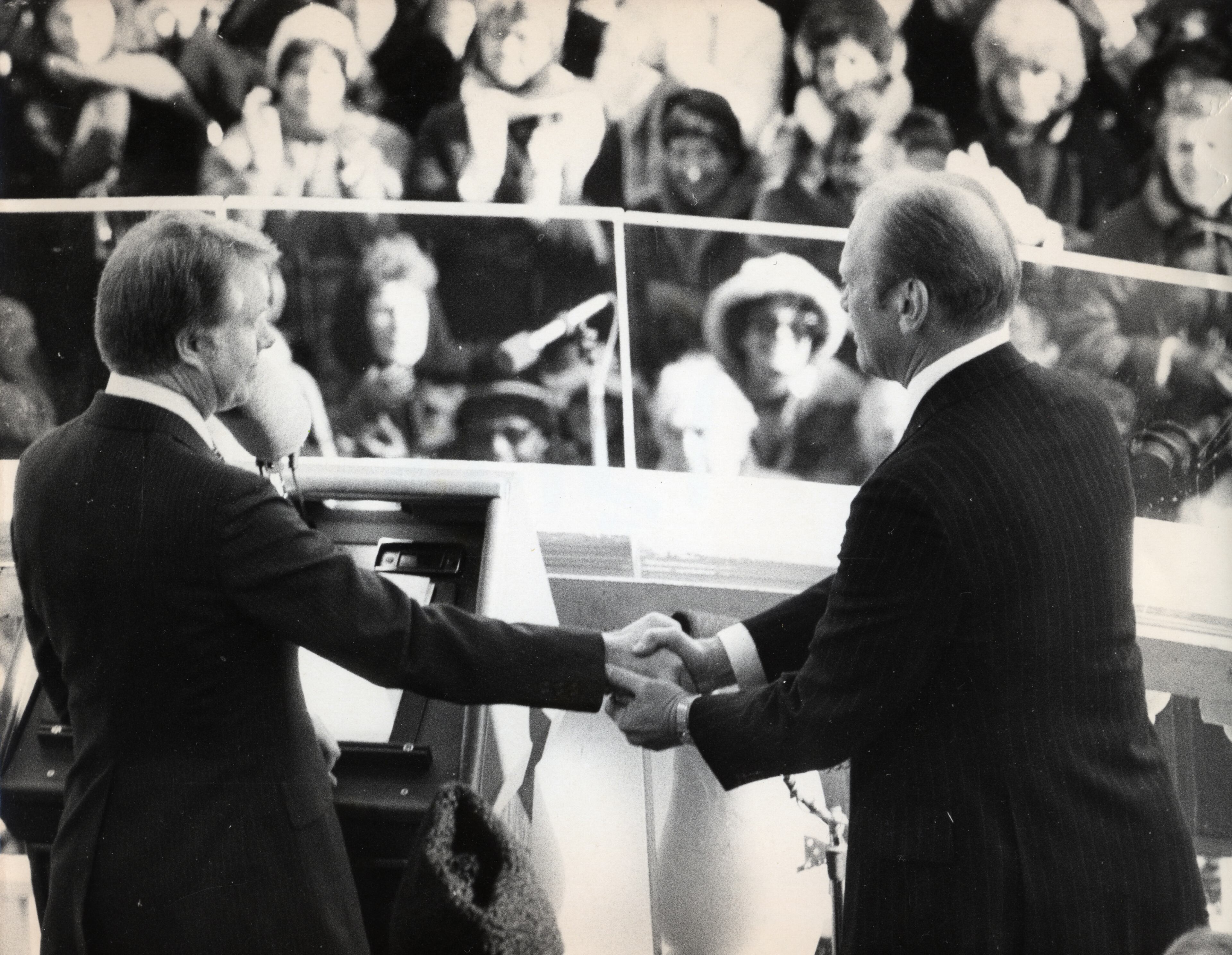Jimmy Carter and Gerald Ford at the January 20, 1977 Presidential Inauguration. Ford had unexpectedly inherited the Oval Office when President Richard Nixon resigned in August 1974, and Carter in his inaugural address thanked Ford “for all he did to heal our land.” He repeated that sentiment more than three decades later when he spoke at his friend Ford’s funeral. Photo Credit: Bill Mahan