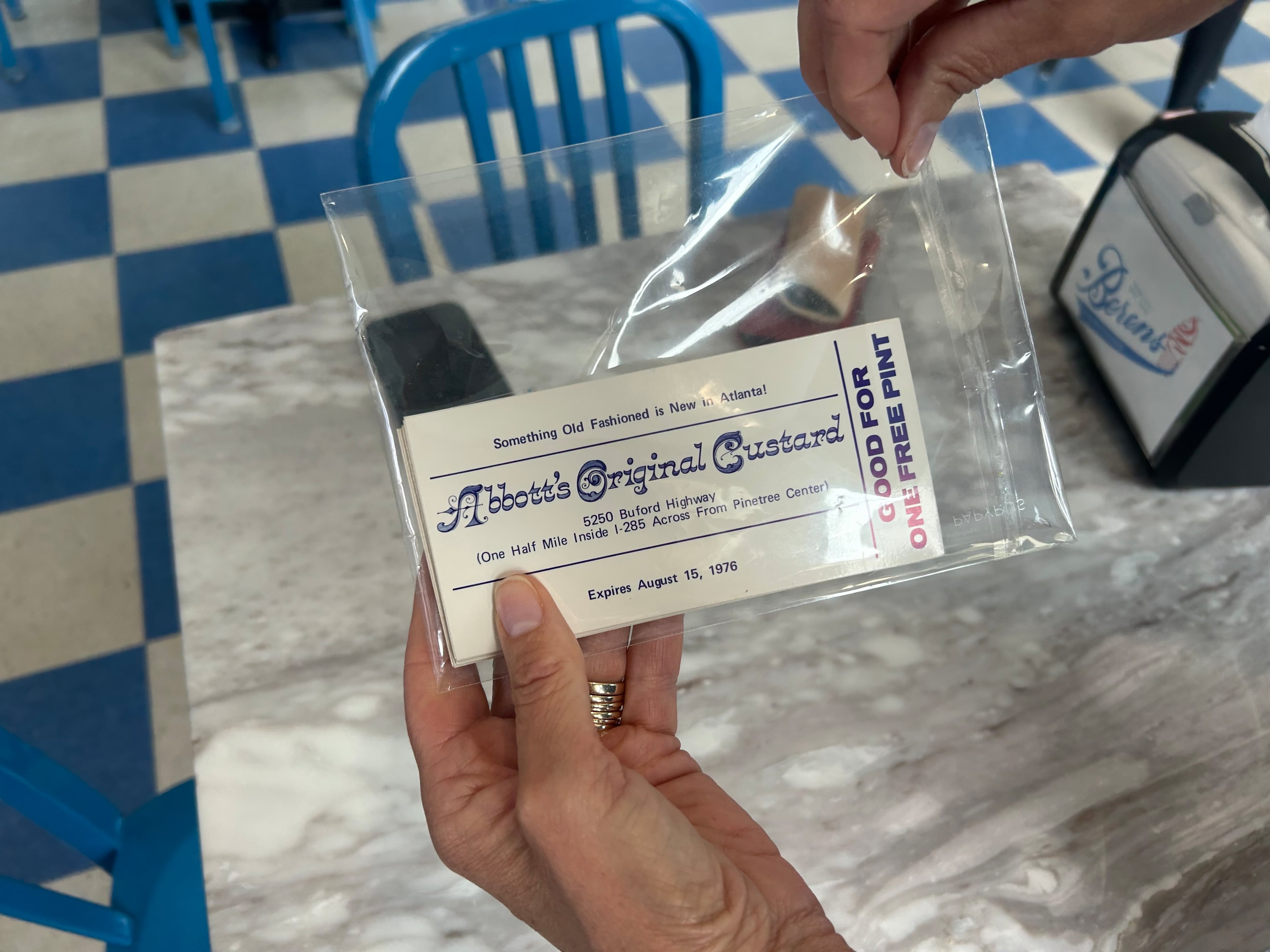 Debbie Berens holds a coupon from father-in-law Don Berens' frozen custard shop that he opened on Buford Highway in 1976. He renamed it to Berens Frozen Custard several years after opening. (Olivia Wakim/AJC)