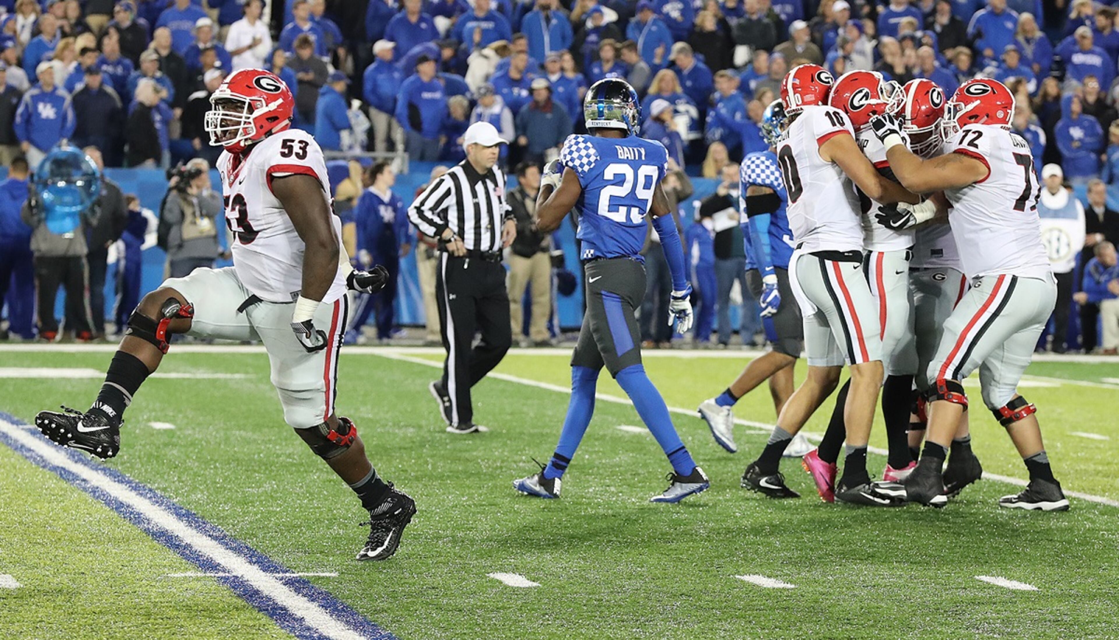 November 5, 2016, LEXINGTON: ââ¬â GAME WINNER ââ¬â Georgia redshirt freshman kicker Rodrigo Blankenship is mobbed by teammates making a field goal as time expires to beat Kentucky 27-24 in an NCAA college football game as Lamont Gaillard (left) high steps his way down the field celebrating while Kentucky defender Derrick Baity walks off the field on Saturday, Nov. 5, 2016, in Lexington. Curtis Compton /ccompton@ajc.com
