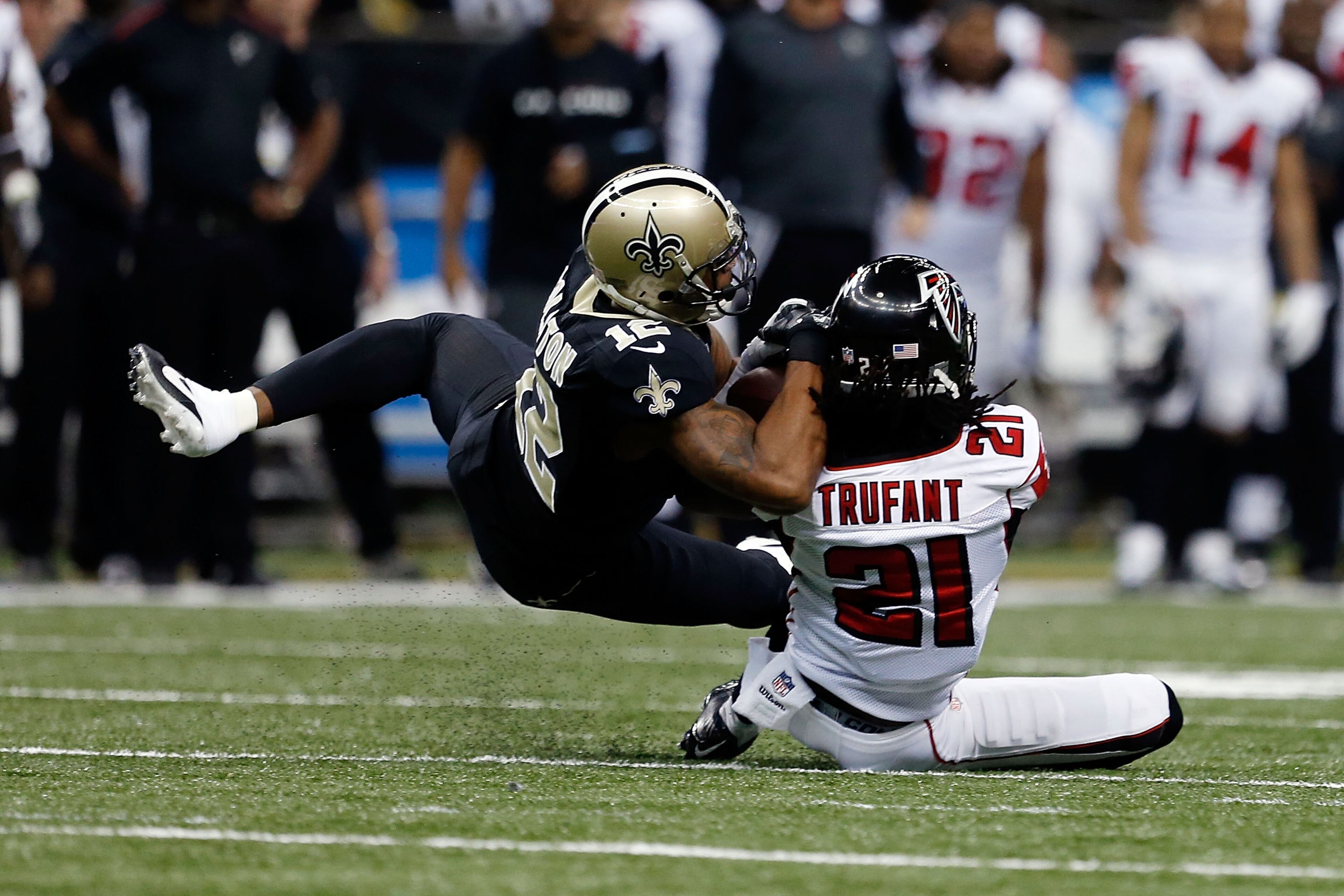 NEW ORLEANS, LA - DECEMBER 21: Desmond Trufant #21 of the Atlanta Falcons intercepts a pass intended for Marques Colston #12 of the New Orleans Saints during the first quarter of a gameat the Mercedes-Benz Superdome on December 21, 2014 in New Orleans, Louisiana. (Photo by Sean Gardner/Getty Images)