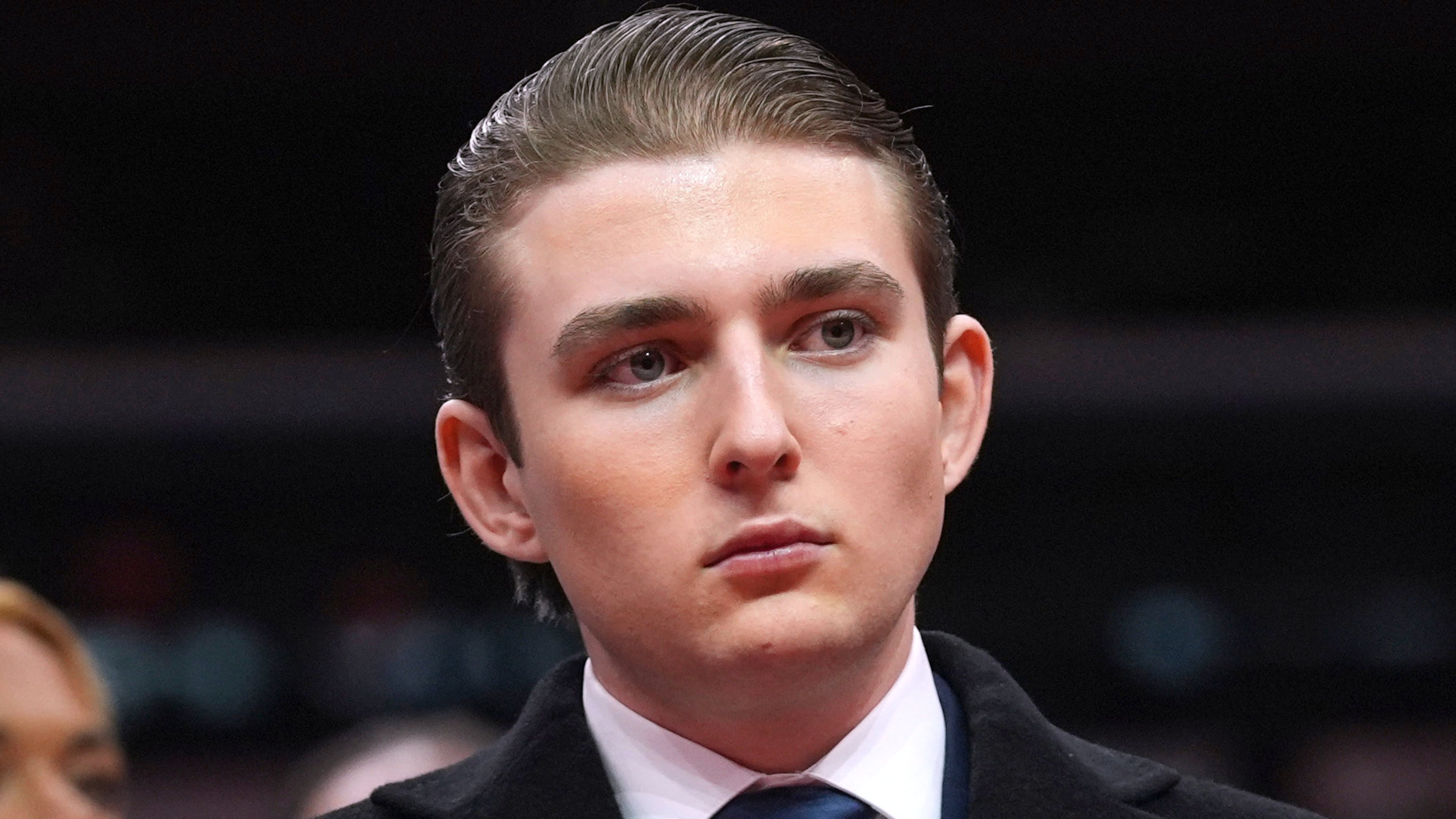 FILE - Barron Trump watches as his father, President Donald Trump attends an indoor Presidential Inauguration parade event at Capital One Arena, in Washington, Jan. 20, 2025. (AP Photo/Evan Vucci, File)