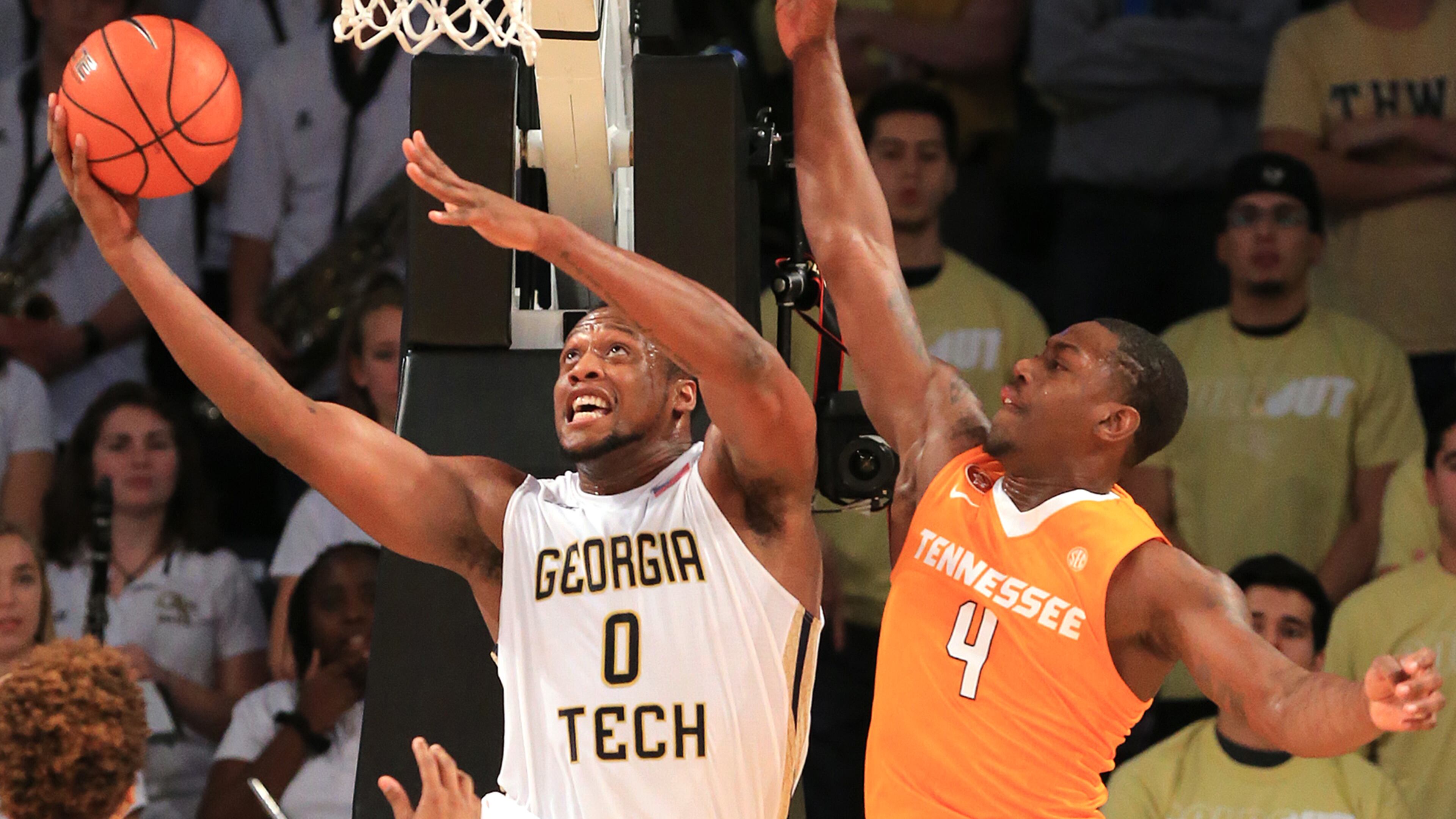111615 ATLANTA: -- Georgia Tech forward Charles Mitchell goes to the basket for a layup past Tennessee defender Armani Moore during the first half in a basketball game on Monday, Nov. 16, 2015 in Atlanta. Curtis Compton / ccompton@ajc.com