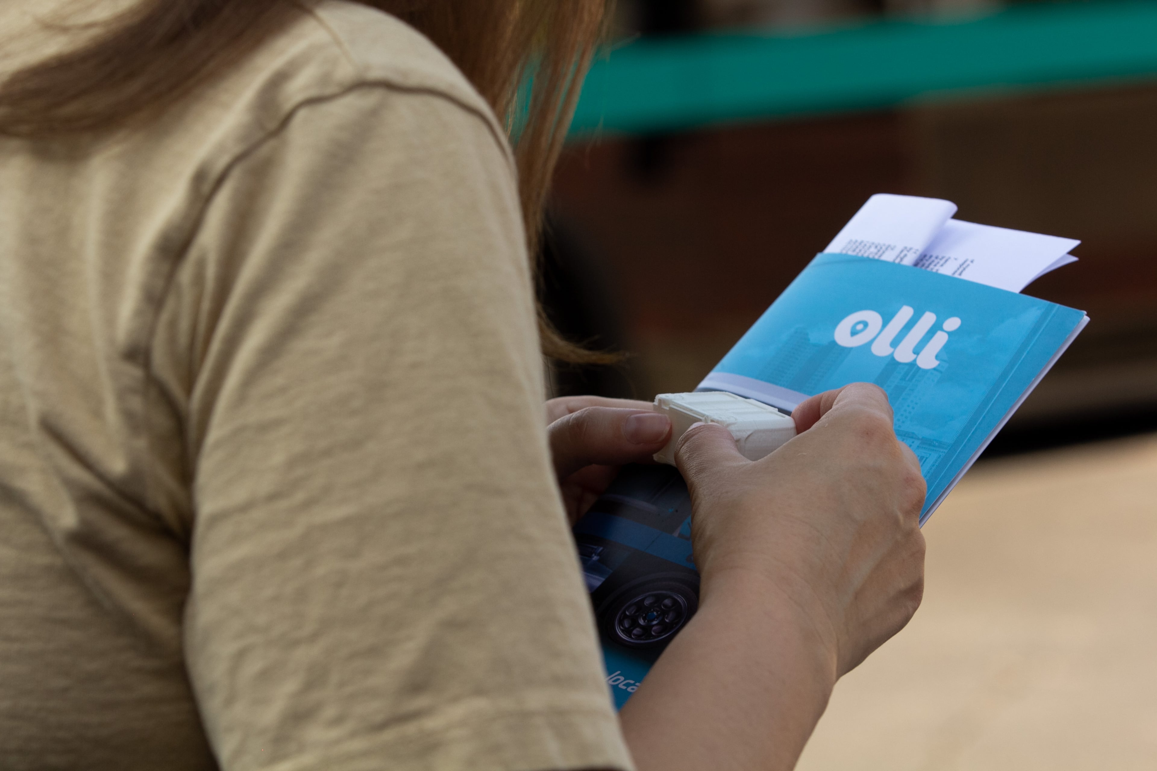 A woman looks at a 3-D printed model of Olli, an autonomous shuttle, in Peachtree Corners, Georgia, on Tuesday, Oct. 1, 2019. Peachtree Corners announced the launch of free autonomous shuttles available to the public on Tuesday. The shuttles will run Monday through Friday from 10 a.m. to 6 p.m. on a 1.5 mile track in the Peachtree Corners Curiosity Lab. (Photo/Rebecca Wright for the Atlanta Journal-Constitution)