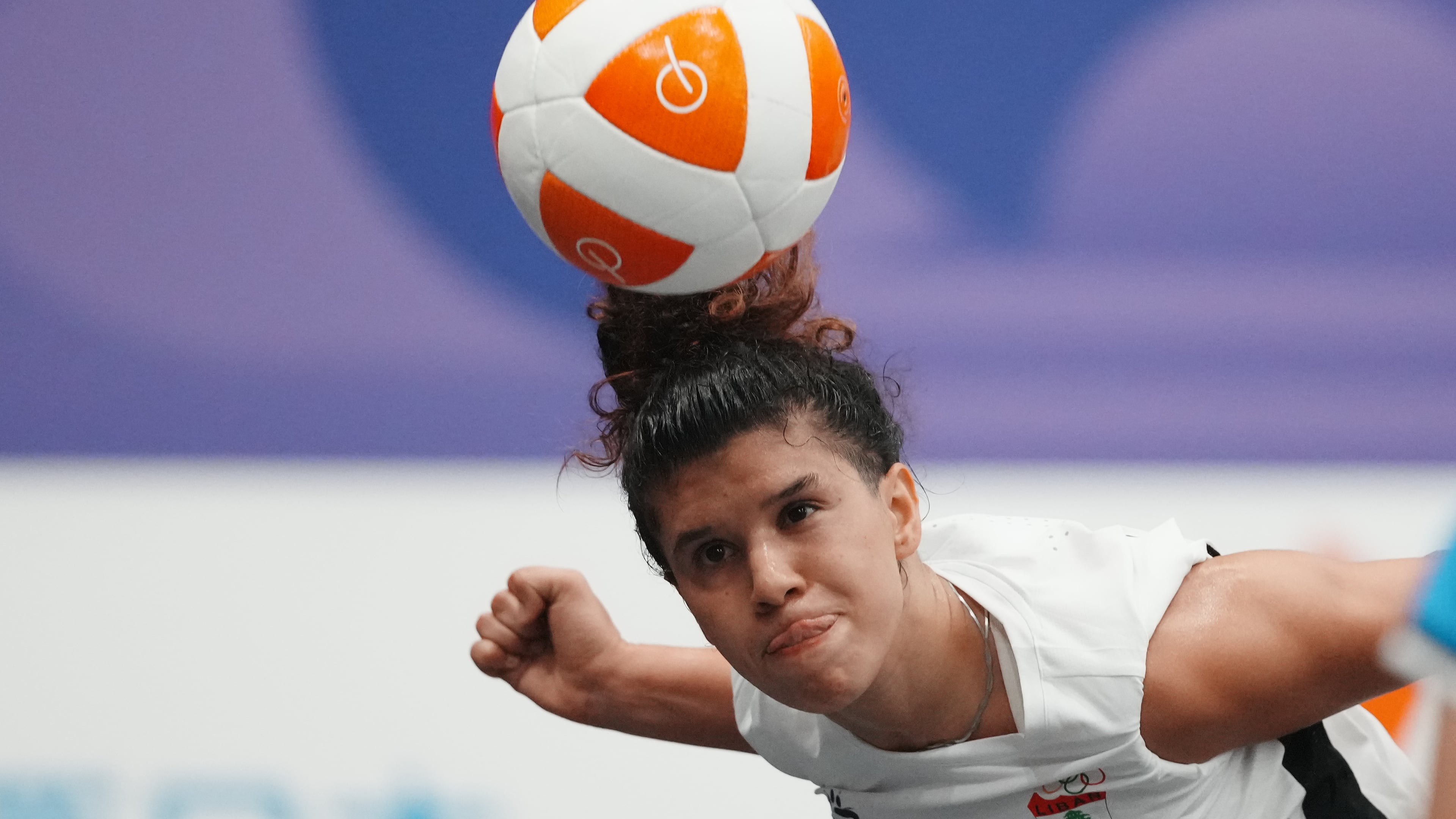 Lebanon's Kamar Dandal controls the ball during the women's singles bronze-medal teqball match against Cambodia's Koemyean Dy at the Asian Games in Nagoya, Japan, Sunday, Sept. 20, 2026. (AP Photo/Lee Jin-man)