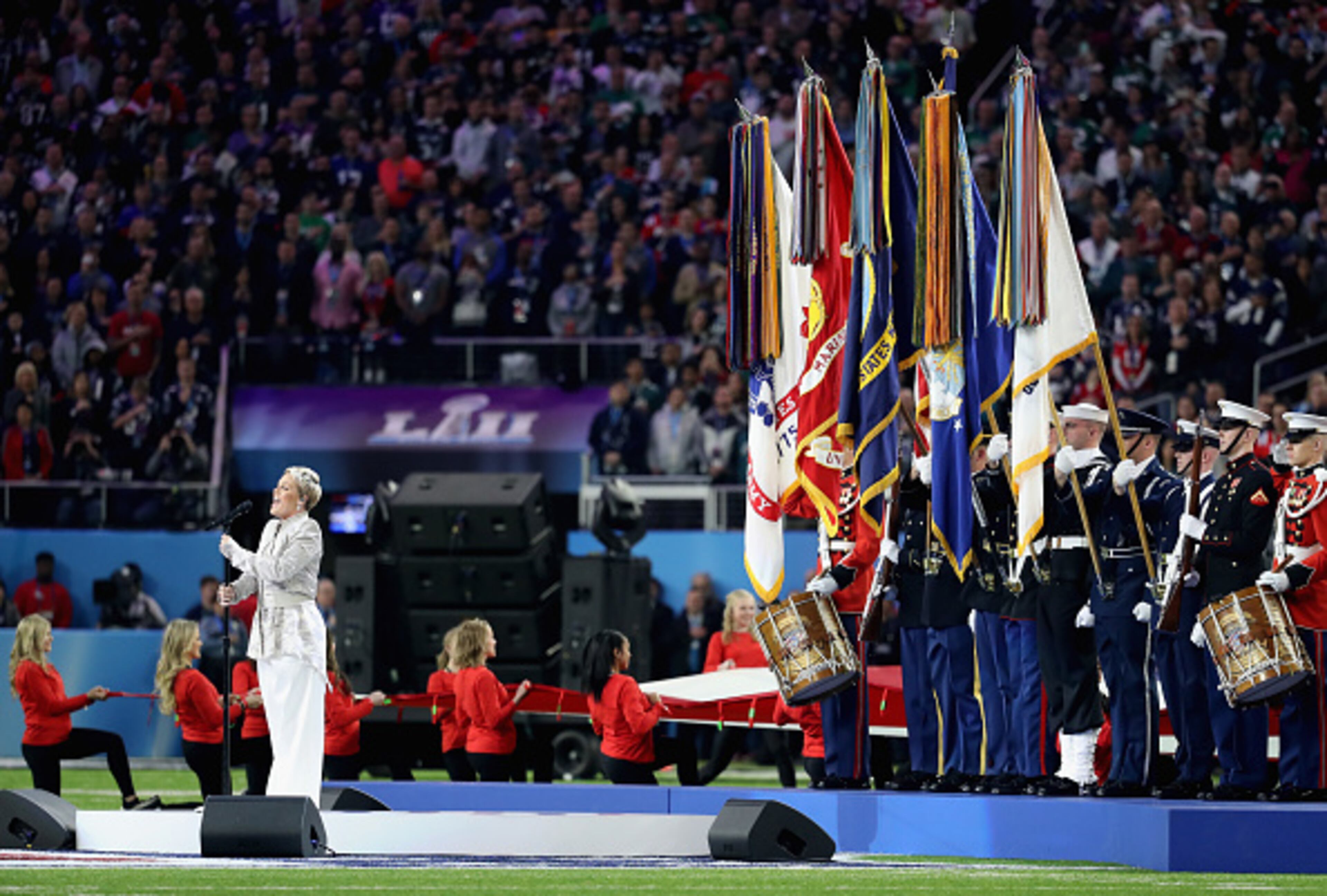 MINNEAPOLIS, MN - FEBRUARY 04: Pink sings the national anthem prior to Super Bowl LII between the New England Patriots and the Philadelphia Eagles at U.S. Bank Stadium on February 4, 2018 in Minneapolis, Minnesota. (Photo by Rob Carr/Getty Images)