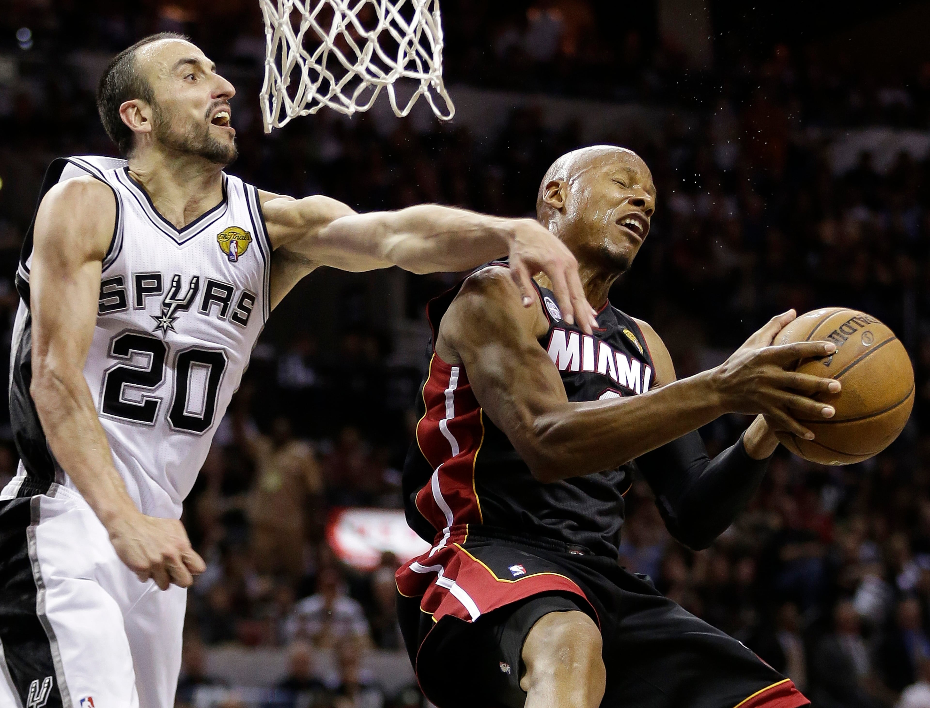 Miami Heat's Ray Allen (34) tries to shoot against San Antonio Spurs' Manu Ginobili (20), of Argentina, during the second half at Game 5 of the NBA Finals basketball series, Sunday, June 16, 2013, in San Antonio. The San Antonio Spurs won 114-104.