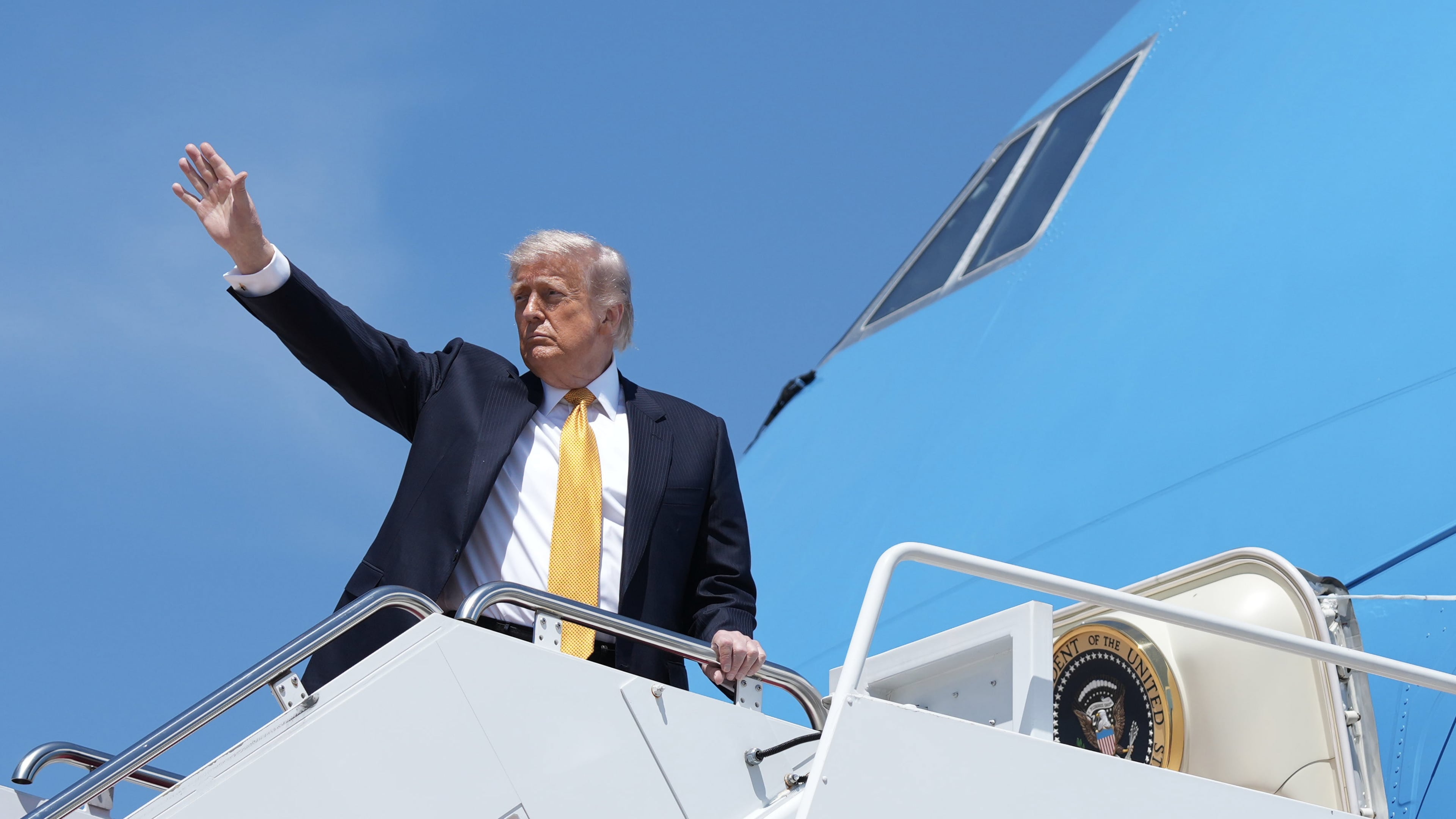 President Donald Trump boards Air Force One Tuesday, May 12, 2026, at Joint Base Andrews, Md., for a trip to China. (AP Photo/Mark Schiefelbein)