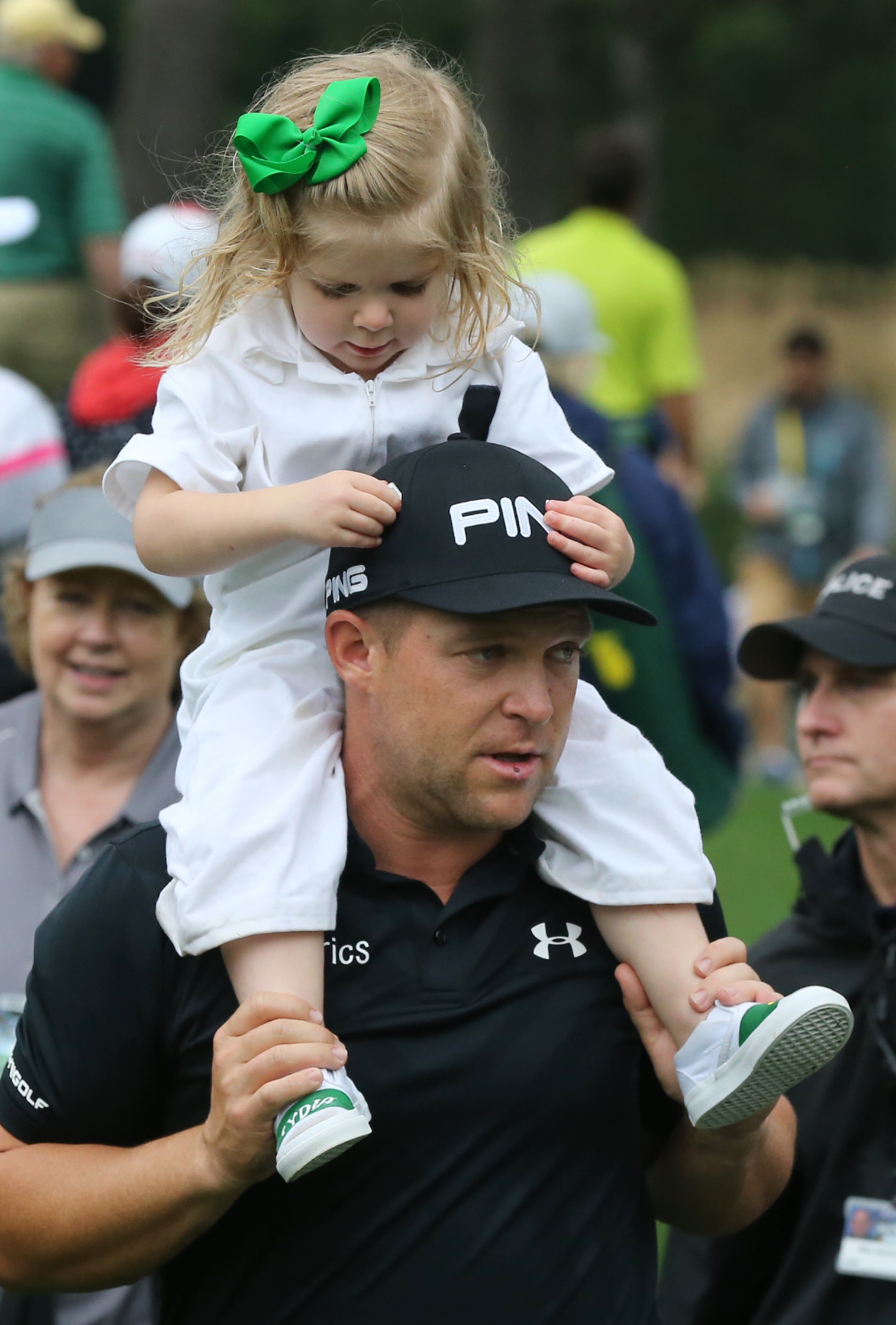 April 5, 2017, Augusta: Daniel Summerhays gives his daughter Lydia a piggy back ride as they leave the Par 3 contest when the course is closed for the day by a weather warning at Augusta National Golf Club on Wednesday, April 5, 2017, in Augusta. Curtis Compton/ccompton@ajc.com