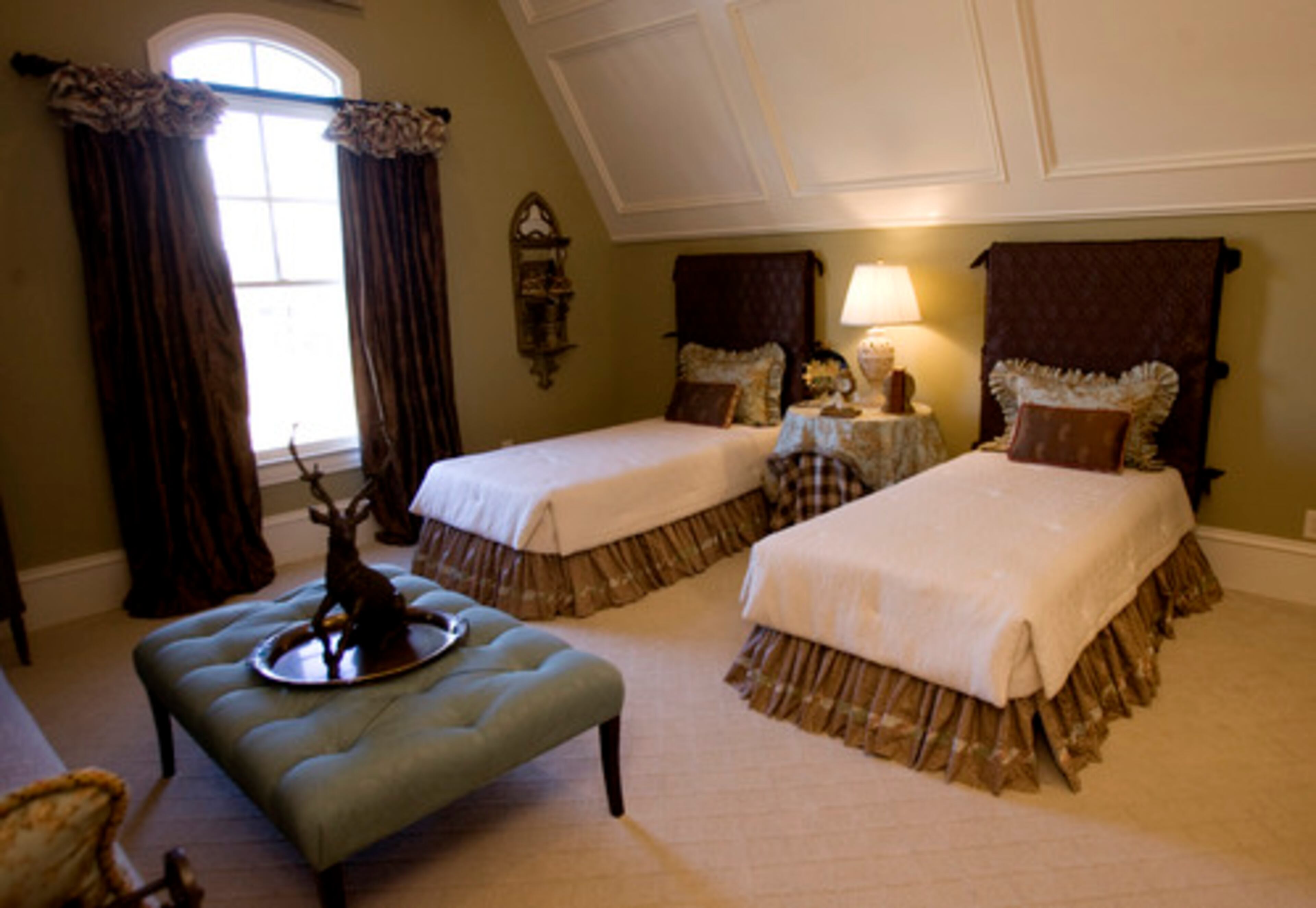 The guest bedroom of Vickery Manor was designed by Magnolia Interior Designs.