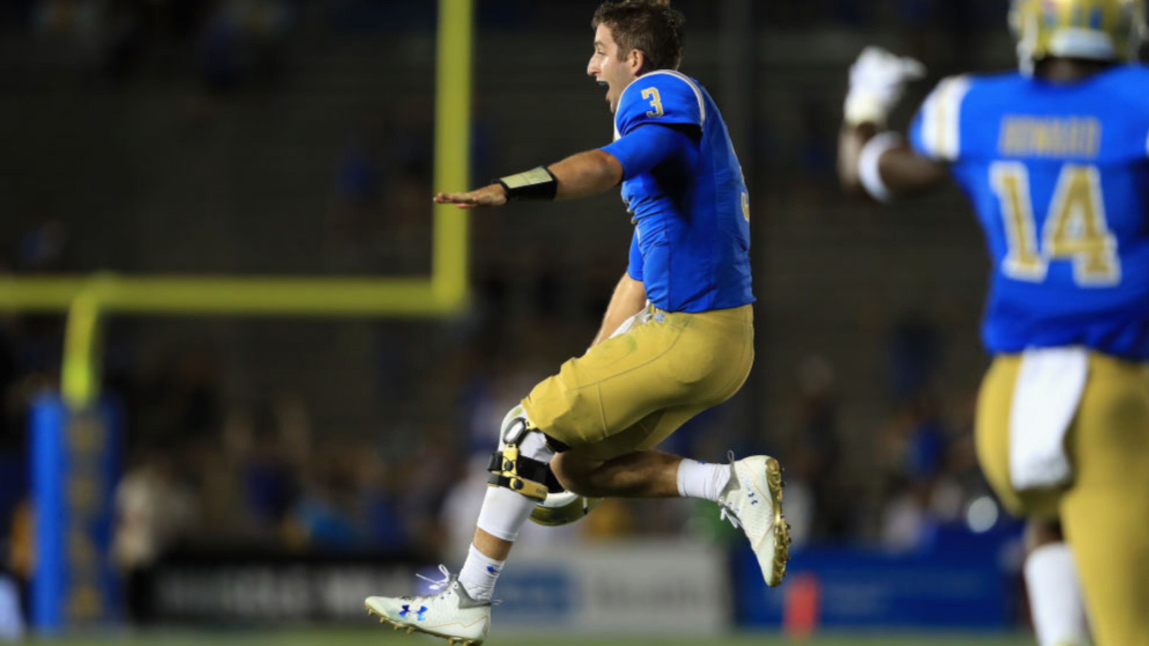 UCLA quarterback Josh Rosen exults after throwing a touchdown to Jordan Lasley late in the fourth quarter of Sunday's college football game.