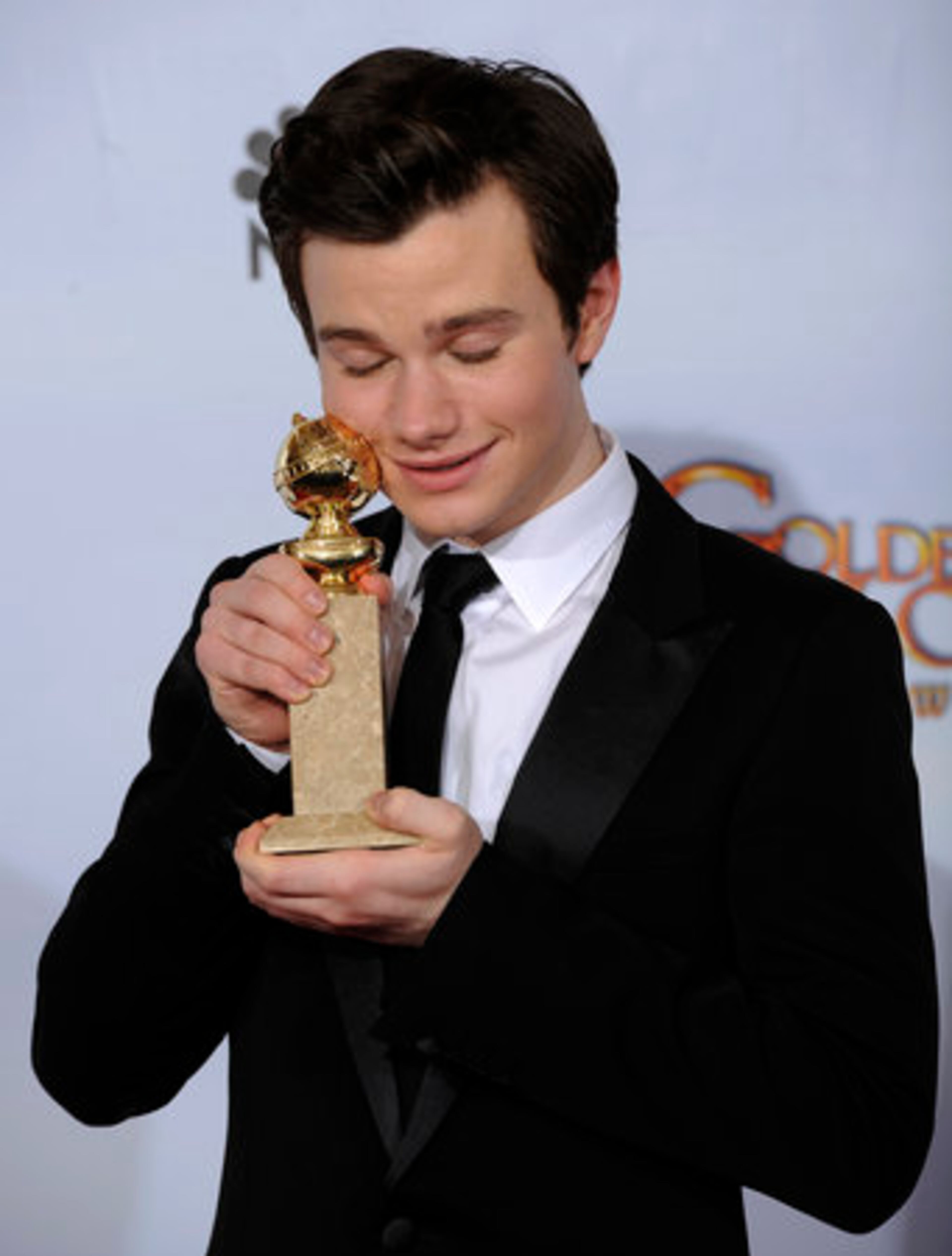 Chris Colfer holds up his award for Best Performance by and Actor in a Supporting Role in a Series, Mini-Series of Motion Picture Made for Television for his role in "Glee, " at the Golden Globe Awards Sunday, Jan. 16, 2011, in Beverly Hills, Calif.