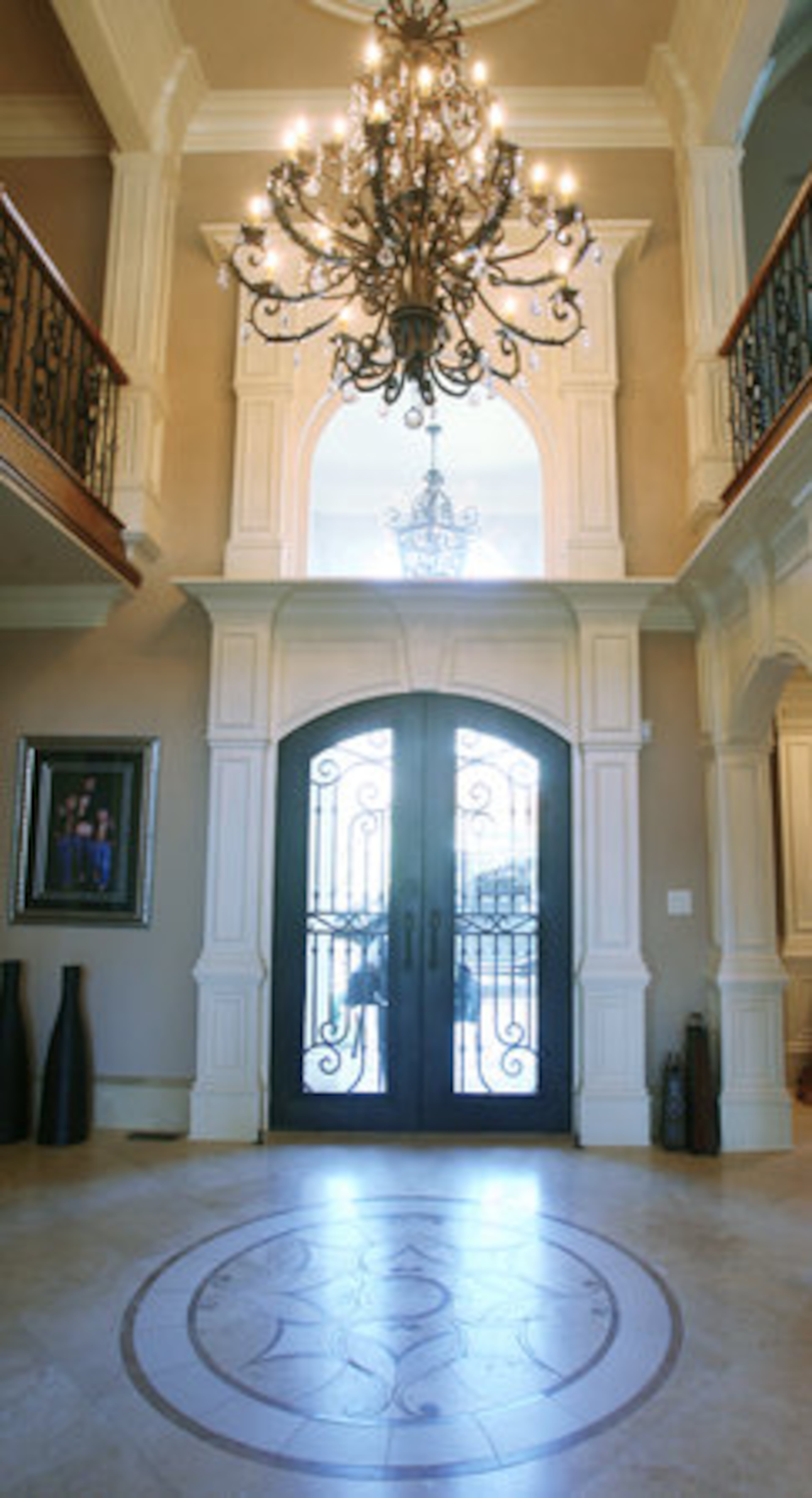 The two-story foyer offers grand entrance into the five-bedroom home. The couple said that several Bravo crews rotated shifts during filming of "The Real Housewives of Atlanta," an adjustment to their ambitious schedules.