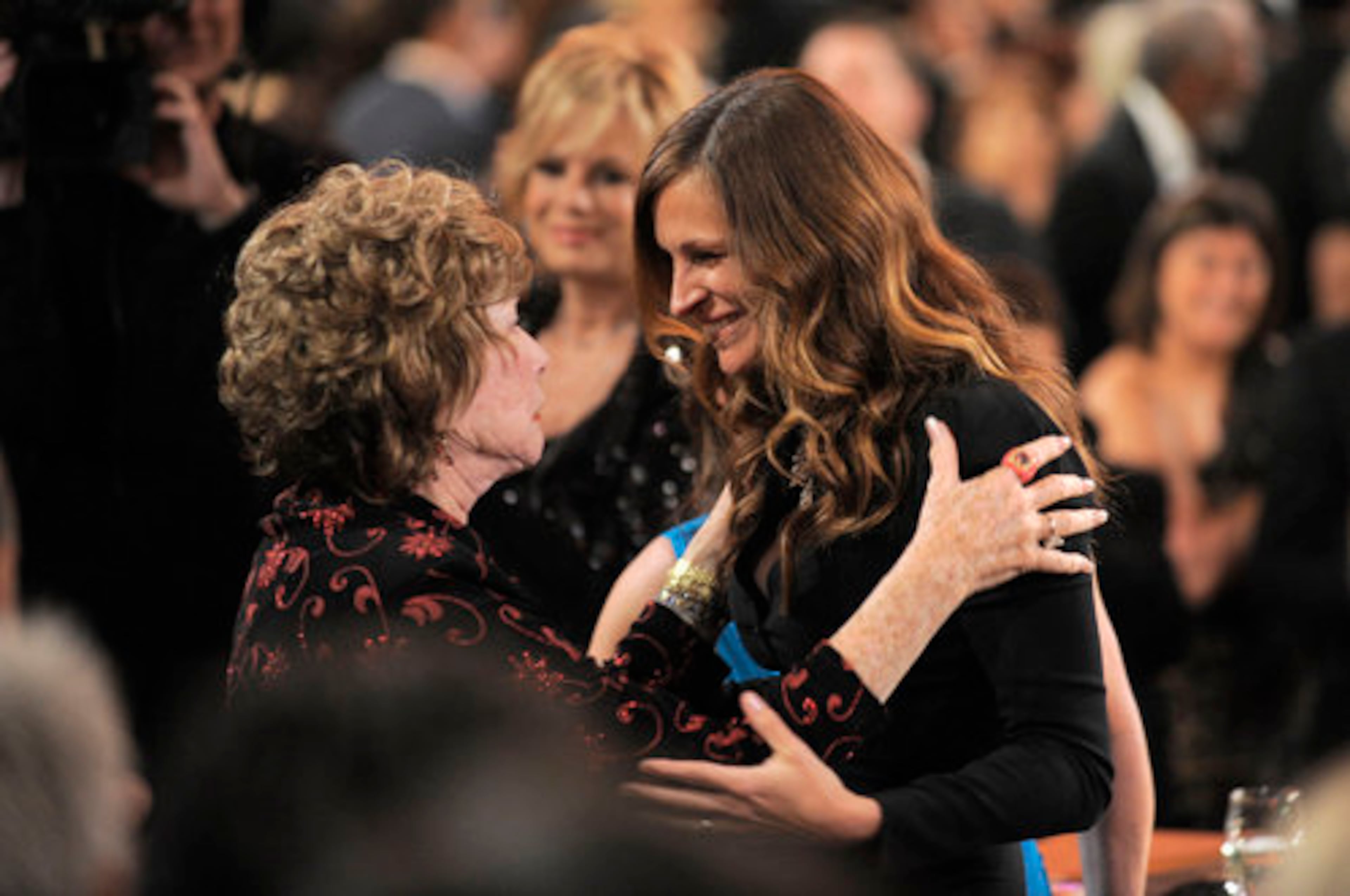 Actress Julia Roberts congratulates Shirley MacLaine. Roberts shared screen with MacLaine in 1989's "Steel Magnolias" and 2010's "Valentine's Day."