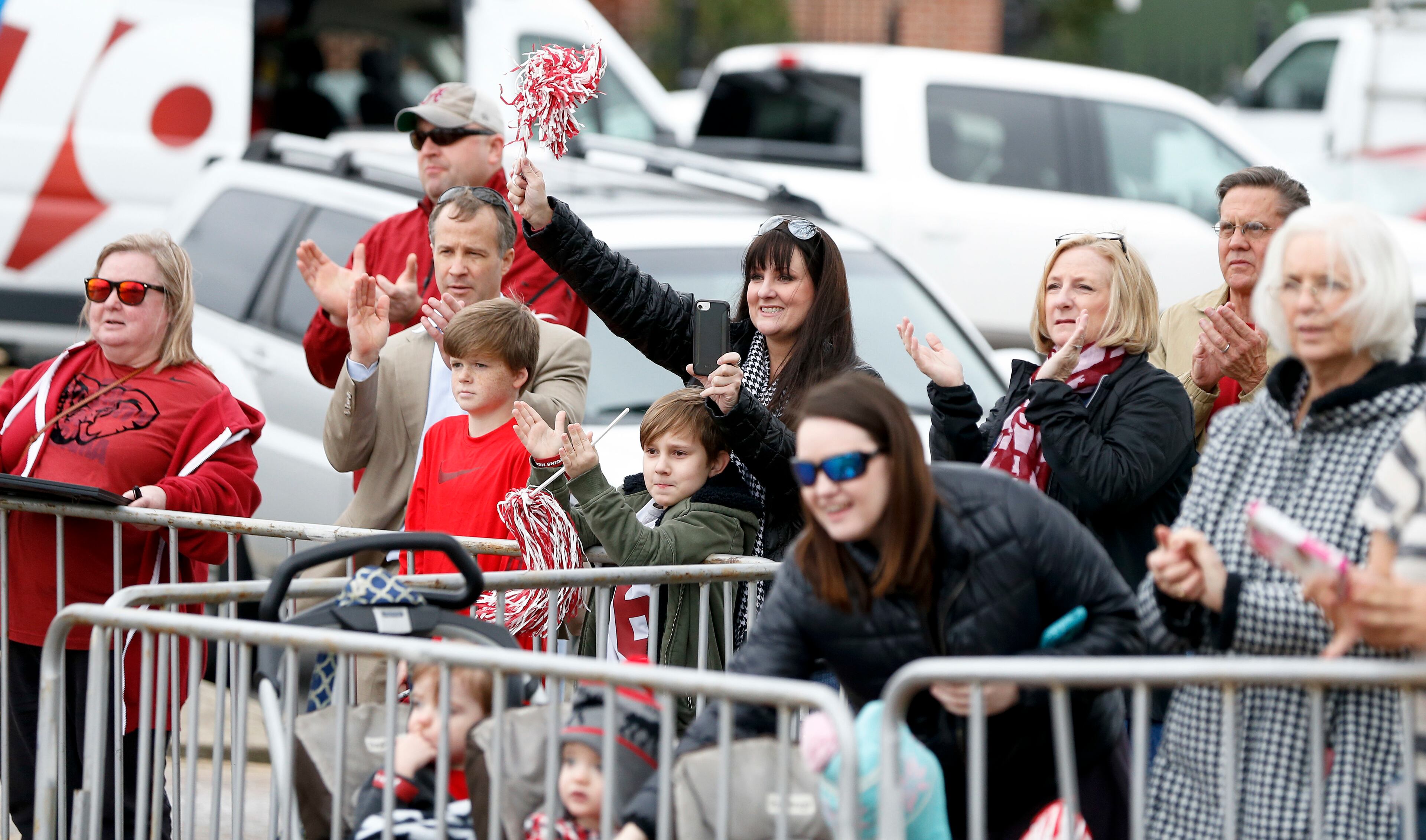 Alabama fans cheer as the players got off the busses on their return home to the University of Alabama, Tuesday, Jan. 10, 2017, in Tuscaloosa, Ala., after their 35-31 loss to Clemson in the the College Football Playoff National Championship NCAA college football game the night before in Tampa. (AP Photo/Brynn Anderson)