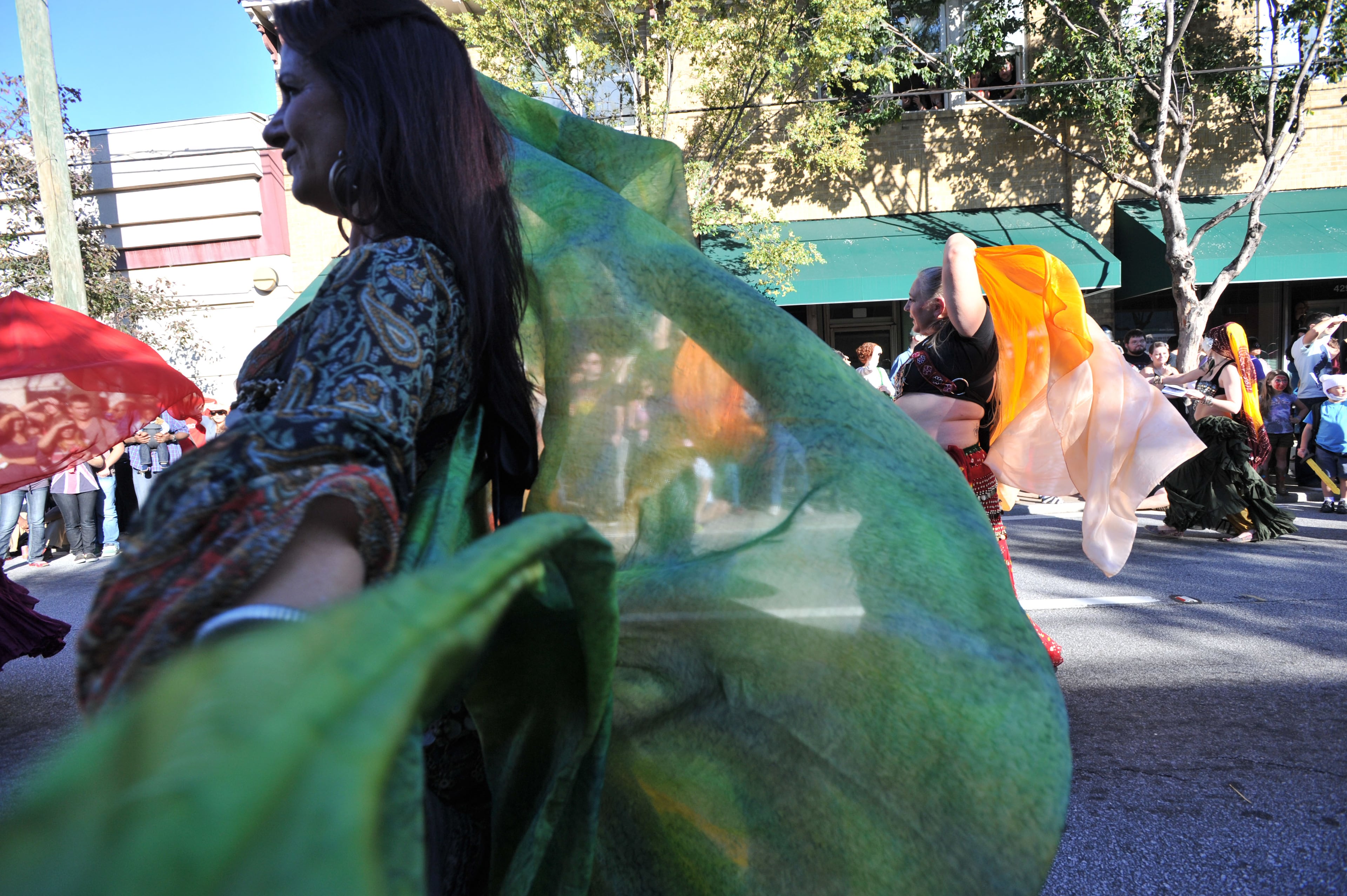 Dancers from Awalim Dance Company perform during the Little Five Points Halloween Parade.