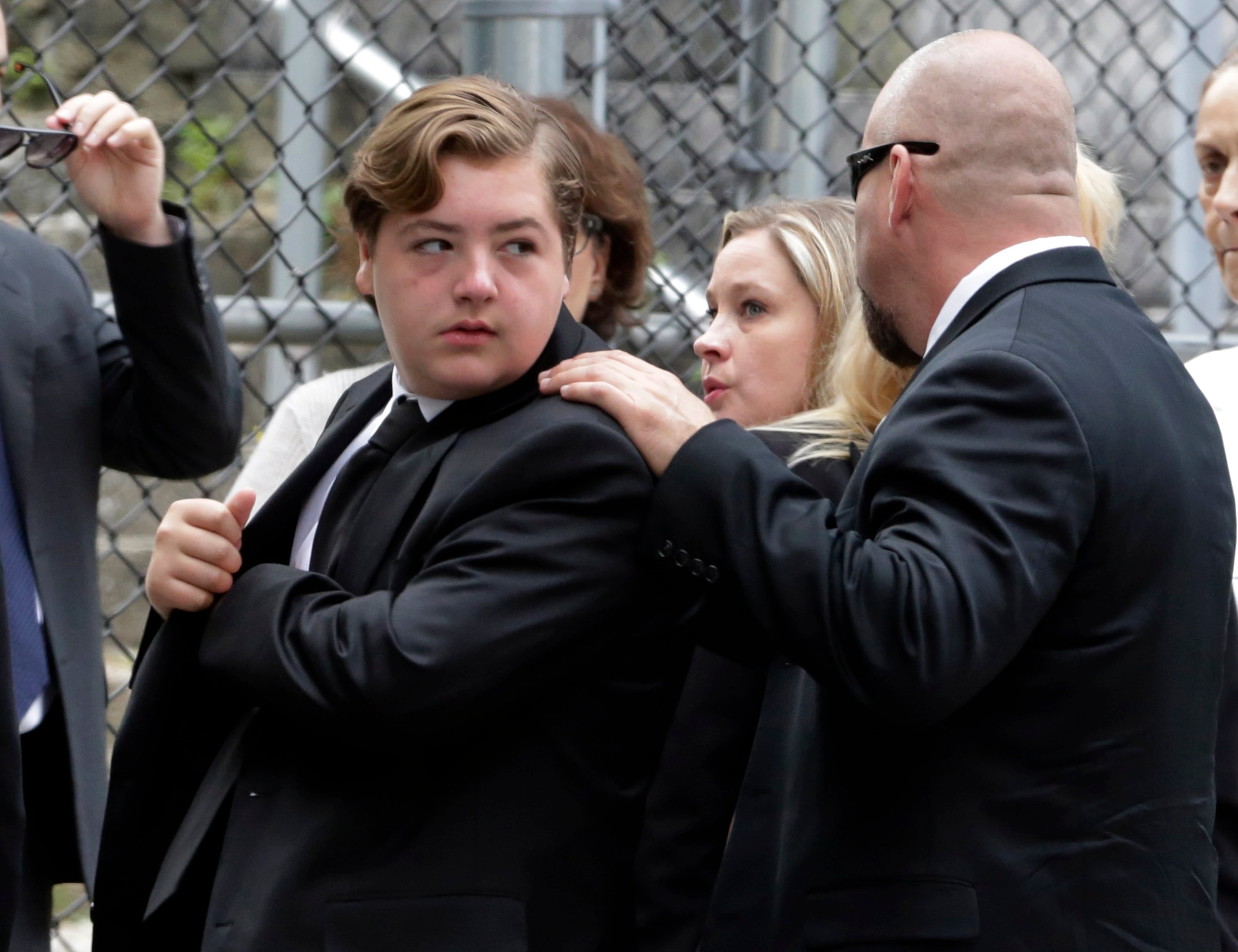 Michael Gandolfini, left, son of James Gandolfini, arrives for the funeral service of his father, star of "The Sopranos," in New York's the Cathedral Church of Saint John the Divine, Thursday, June 27, 2013. The 51-year-old actor died of a heart attack last week while vacationing in Italy with his son.(AP Photo/Richard Drew)