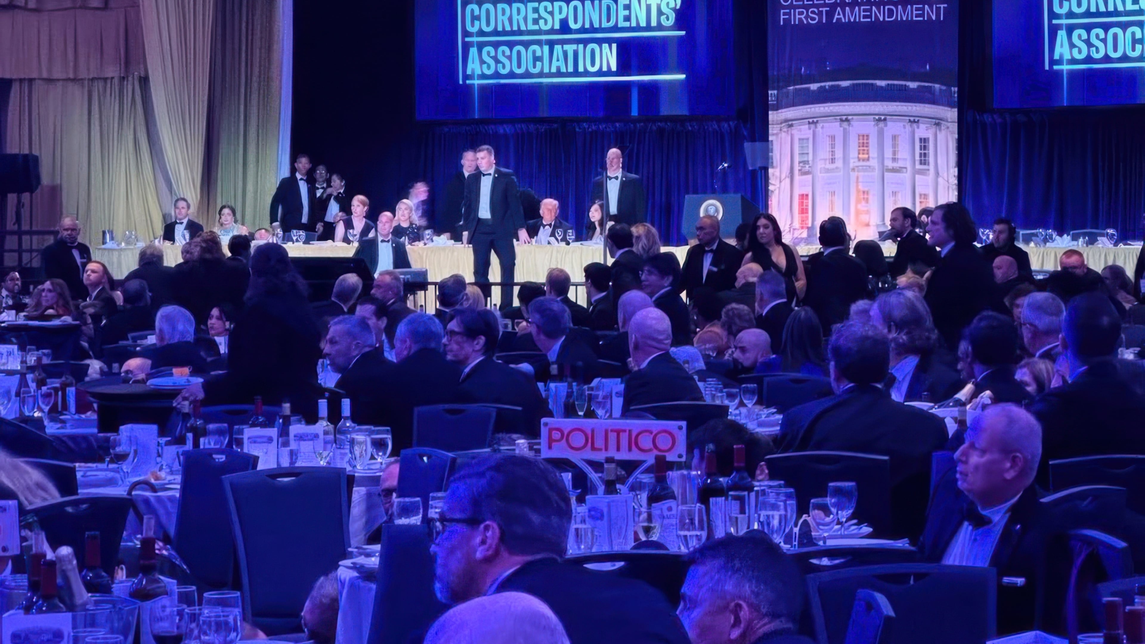 FILE - Secret Service agents respond near President Donald Trump and first lady Melania Trump during the White House Correspondents Dinner in Washington, April 25, 2026. (AP Photo/Alex Brandon, File)