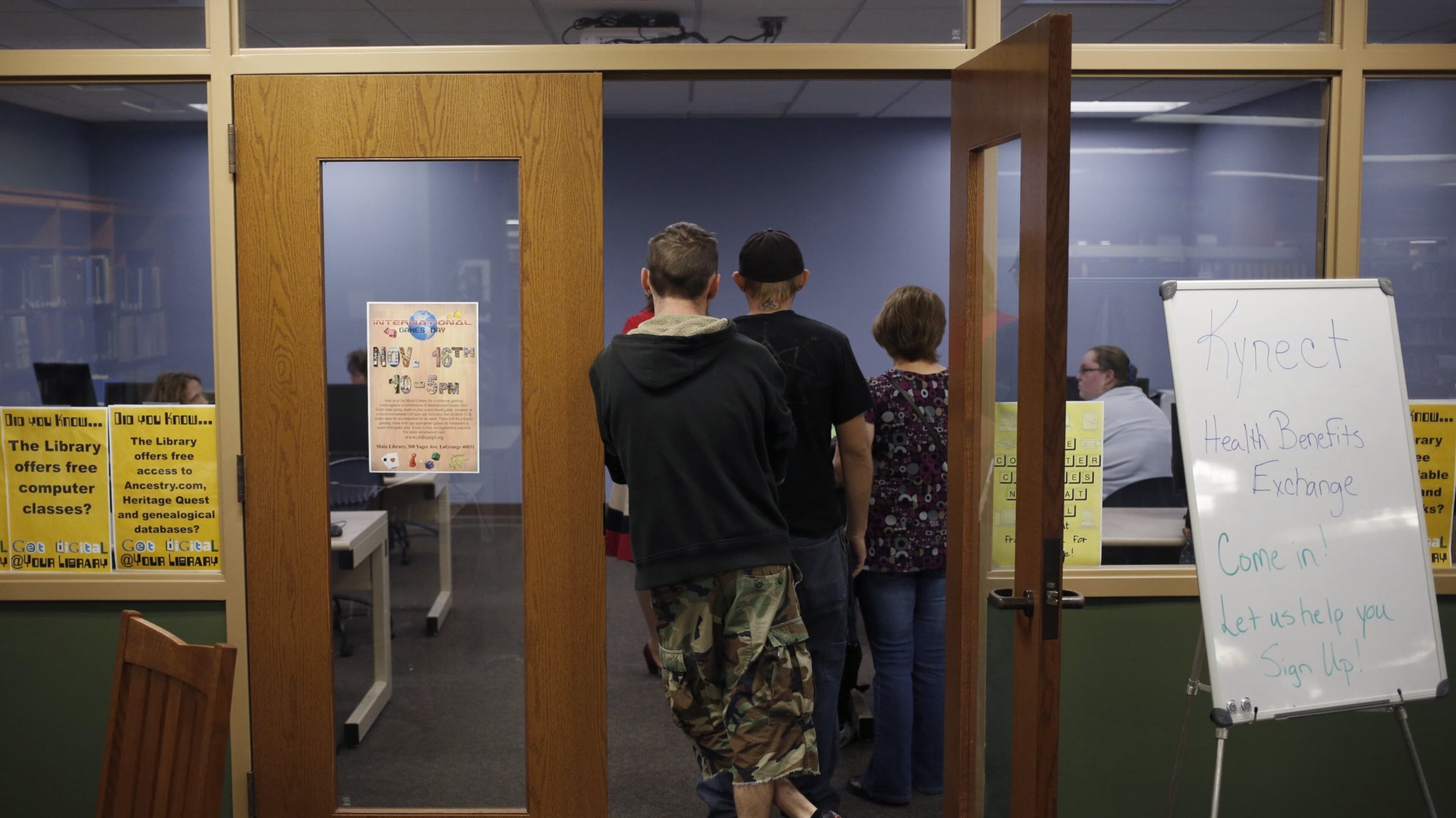 Attendees line up an Affordable Care Act open enrollment event at a public library in La Grange, Ky., Oct. 21 2013. Compared to the struggling federally-run exchange, Kynect has been a success, enrolling a reported 1,000 Kentuckians a day, and officials credit a well-funded outreach program and an extensively-tested website for the smooth rollout. (Luke Sharrett/The New York Times)